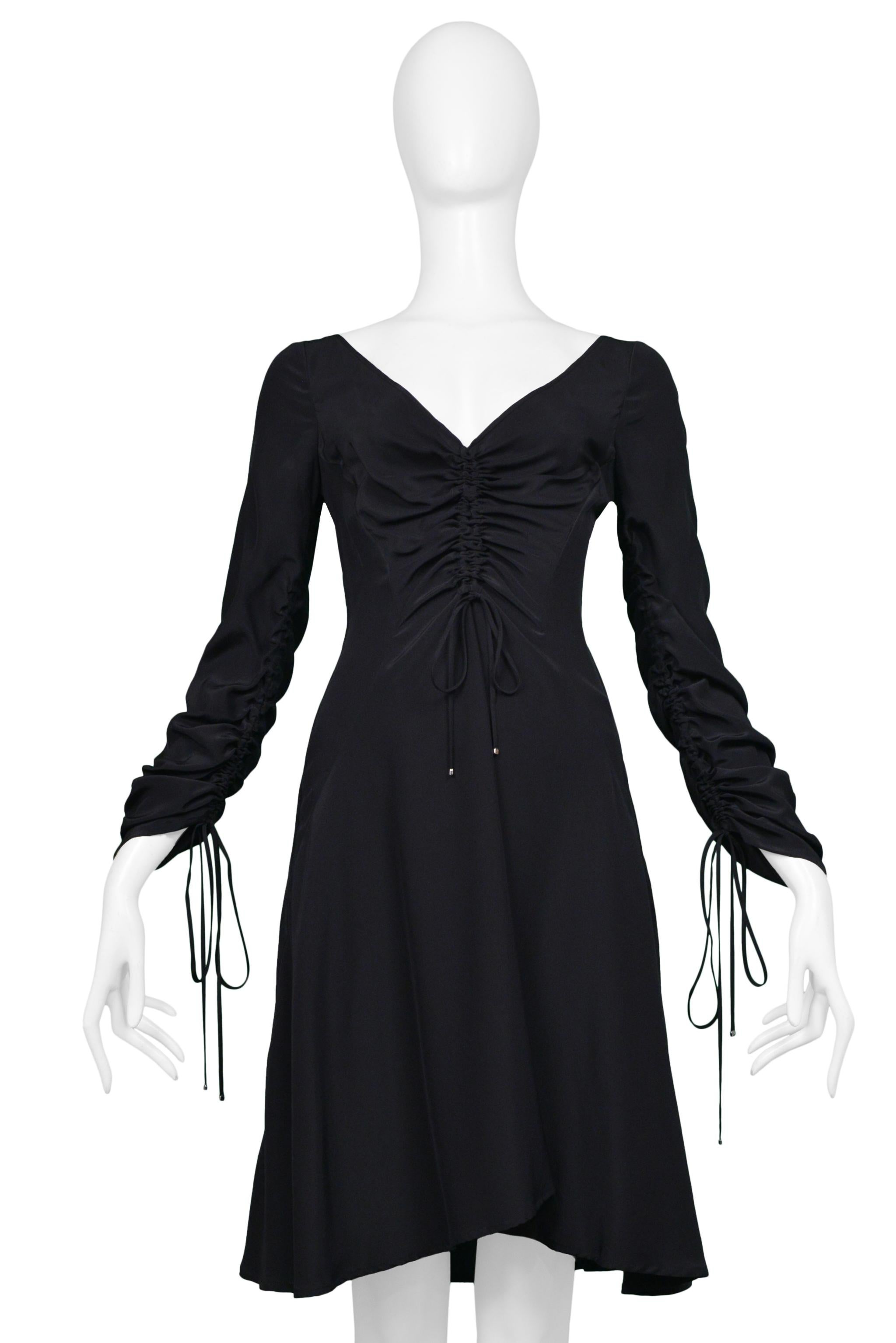 Noir Versace, mini-robe noire avec cordons de serrage et décolleté plongeant, années 2000 en vente