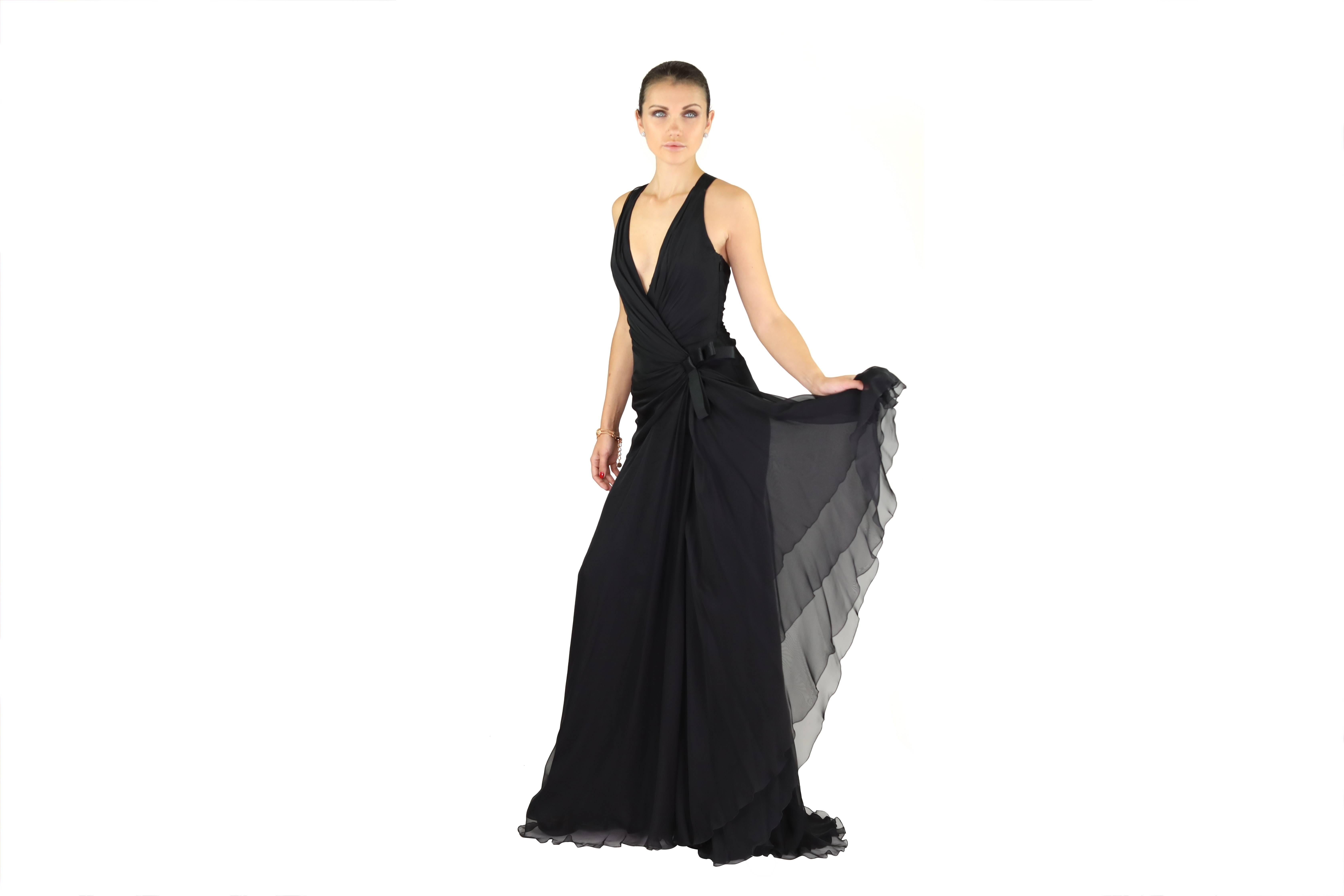 VERSACE 


 Black Silk Long Dress
Deep V-neck
Cutout at the back
Decorative bows on the waist and back

Content: 100% silk,
Lining: 80% silk, 20%polyamide

 IT  Size 38 - US 2

Armpit to armpit: up to 16