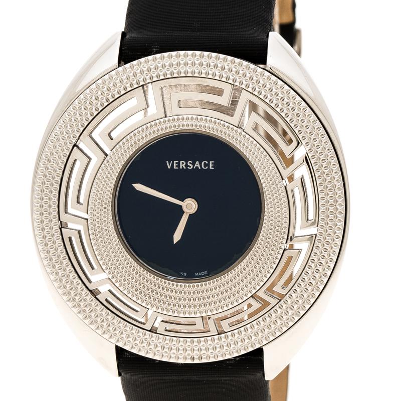 This is a classic designer timepiece from the house of Versace. The round black dial houses steel hands and the ‘Versace’ brand name. The case has the ‘Versace key’ pattern with double hobnail finished bezels. This 30m water resistant wristwatch