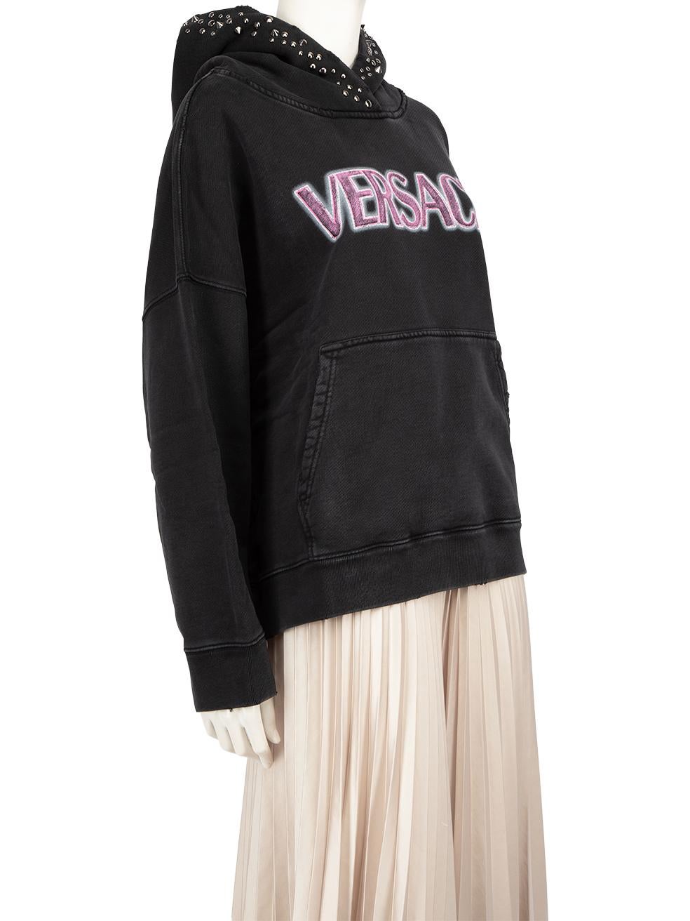 CONDITION is New with tags on this brand new Versace designer item. This item comes with original packaging.
 
 
 
 Details
 
 
 Model: 1008170
 
 Season: FW23
 
 Black
 
 Cotton
 
 Hoodie
 
 Vintage wash effect logo print
 
 Silver studded hood
 
