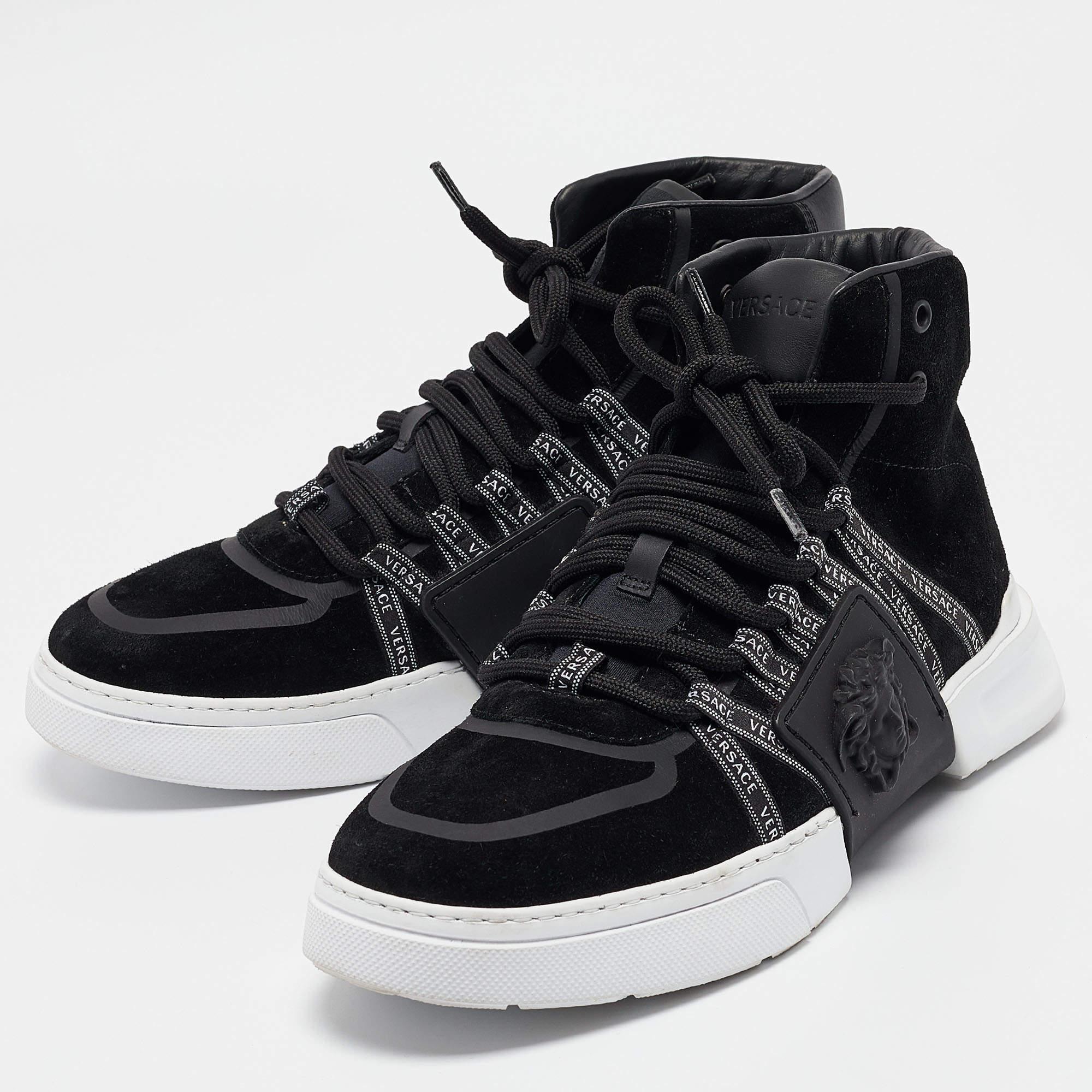Set in a high top silhouette  these Versace black sneakers are a seamless combination of luxury  comfort  and style. These sneakers are finished with signature details and comfortable insoles.