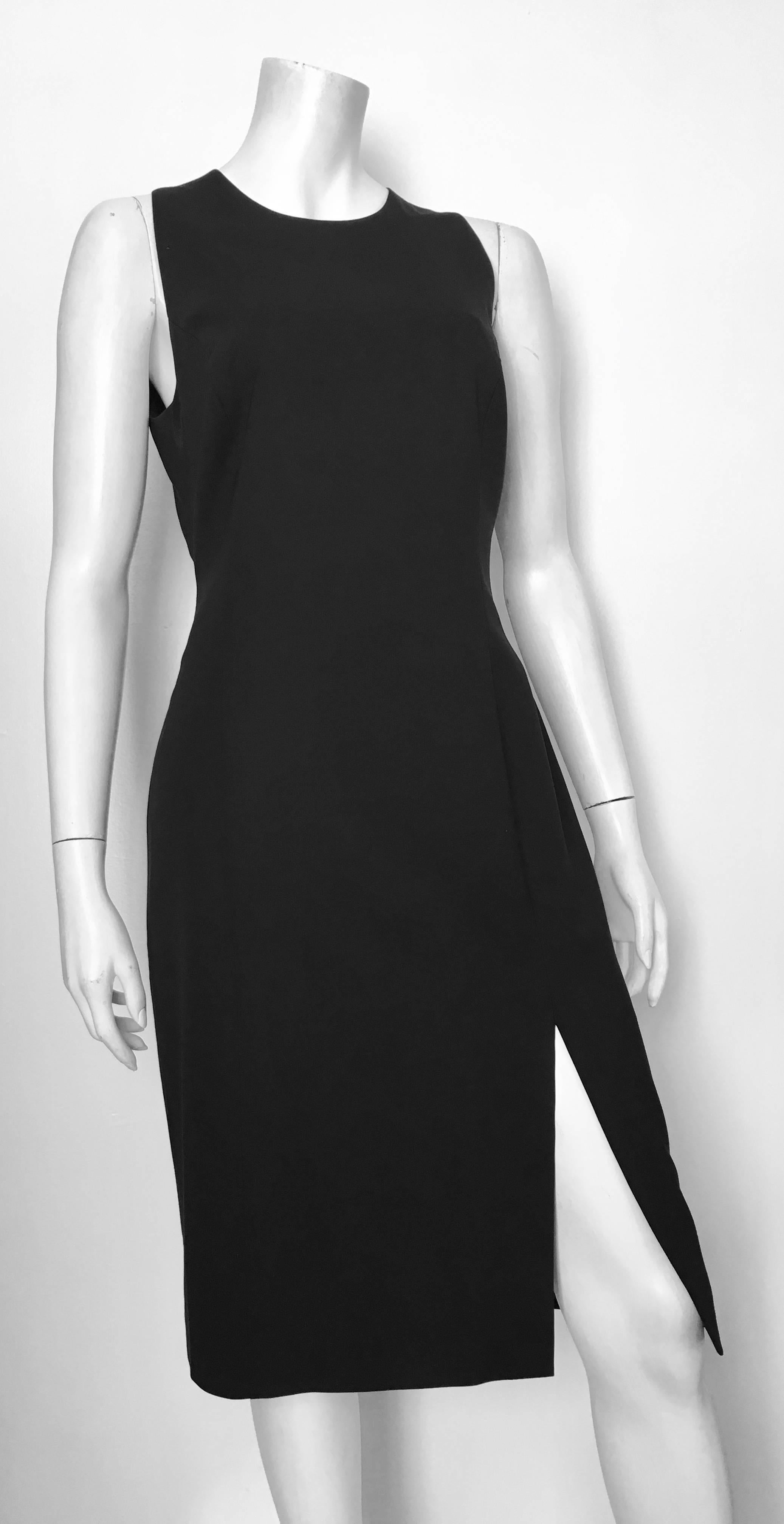 Versace sleeveless black wool sheath dress is labeled an Italian size 46 and fits like a size 8. The waist on this dress is 30. 1/2