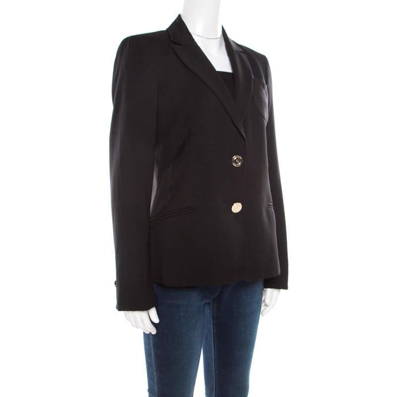 The sophisticated blazer from Versace offers comfort without compromising on style. The gold-tone logo buttons add a lovely touch to the amazing piece. Tailored from wool, this black blazer can be worn with trousers or over a dress.

