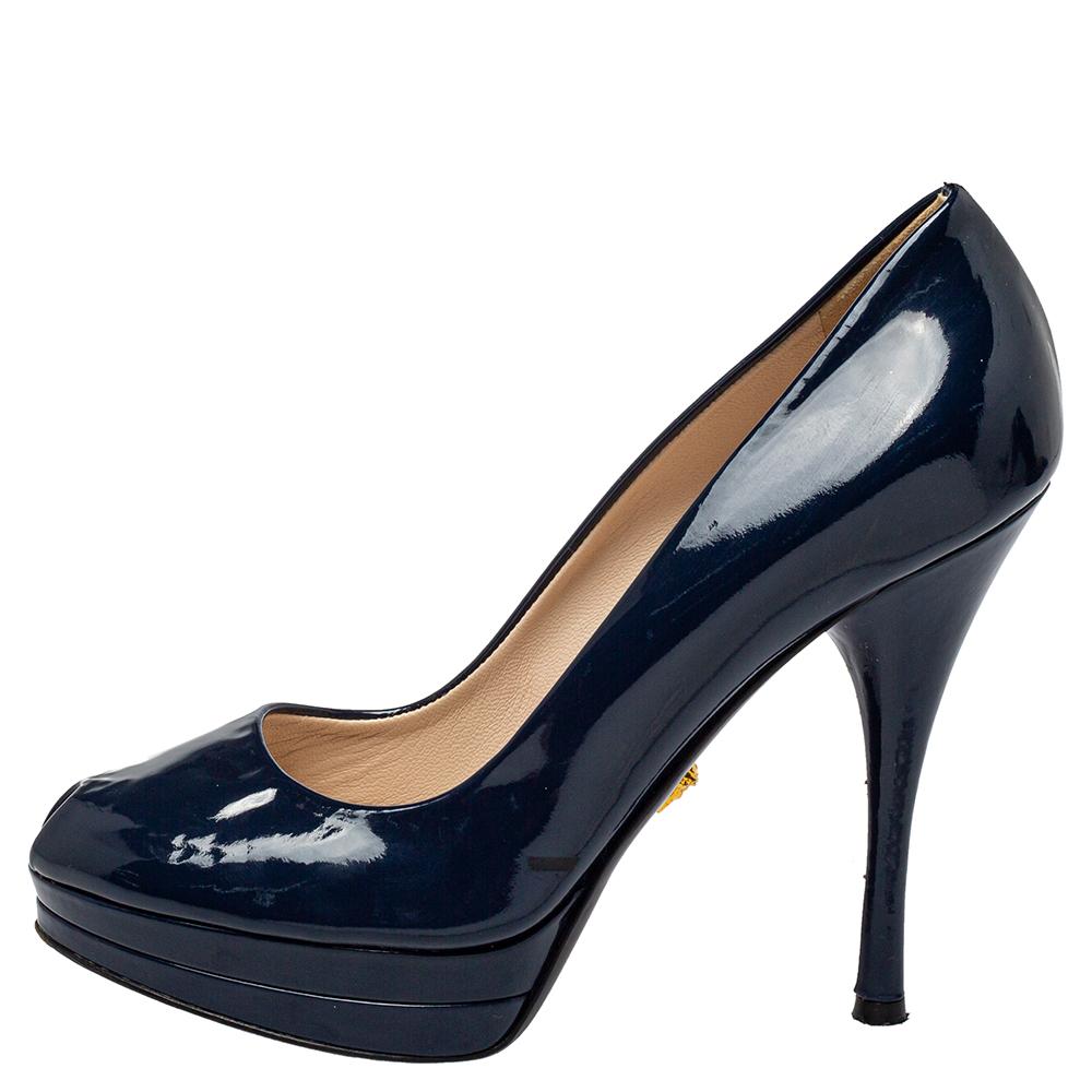 You can never go wrong with these pumps from Versace. Crafted from quality patent leather, they come in a lovely shade of blue. They are styled with peep toes, platforms, 12 cm high heels, and a sculpted top line. They are great for special