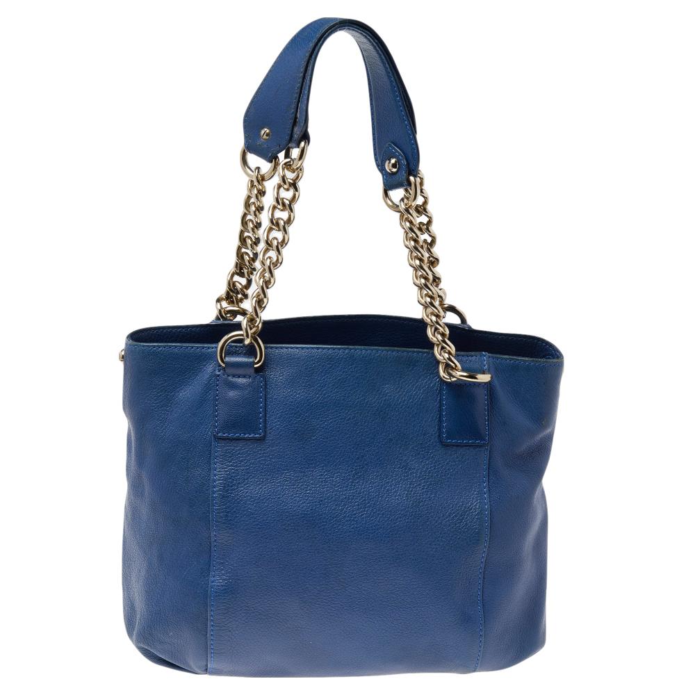 This leather bag is gorgeous enough to upgrade any look. It boasts a perforated Medusa motif on the front, two handles, and a spacious fabric-lined interior. This Versace hobo in a blue hue is just what you need to finish your look.

Includes:
