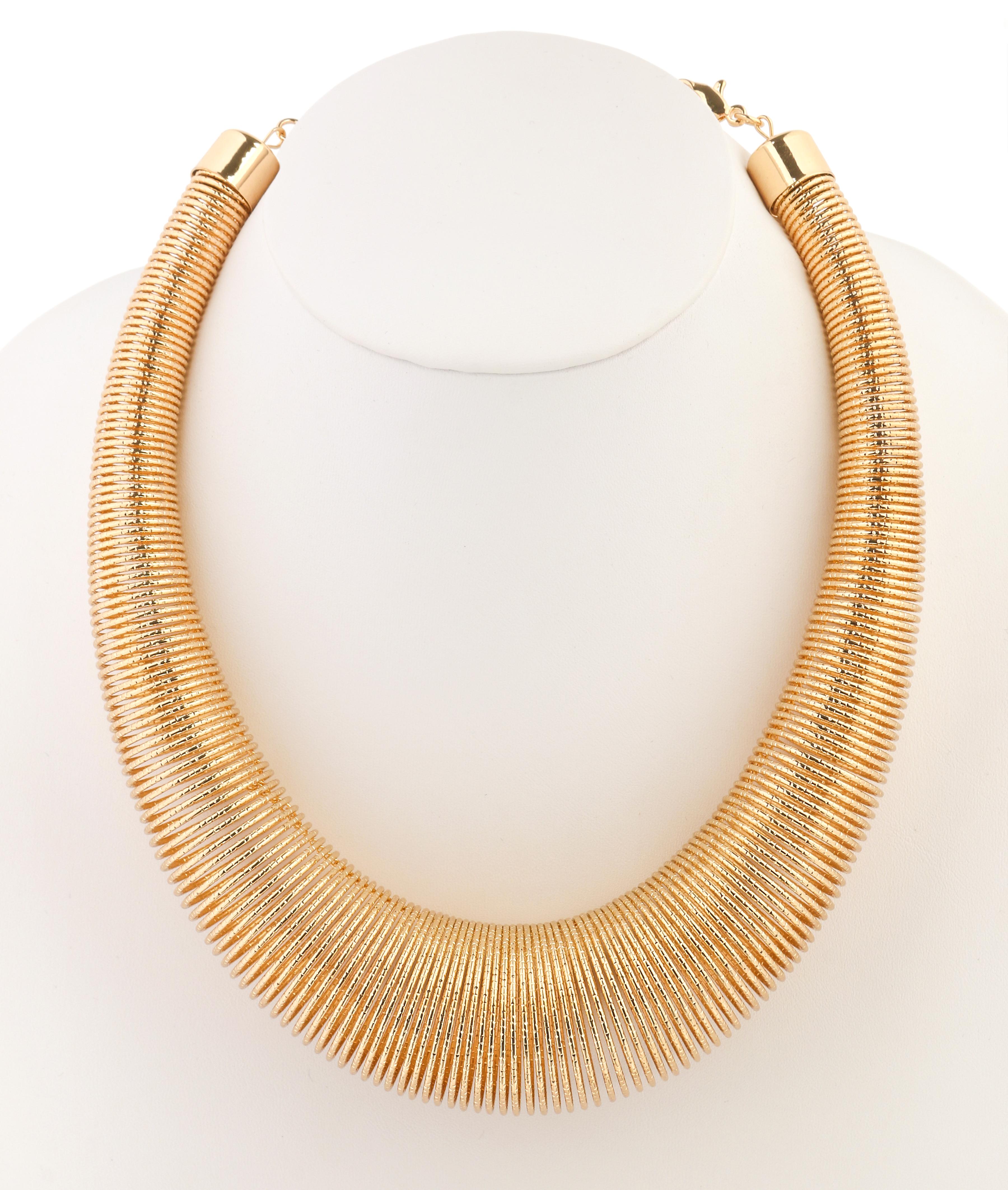 Vintage c.1980's Versace designed by Ugo Correani new old stock gold coil necklace. Large gold tone hammered metal spiraling coil body (approximately measuring 1.4