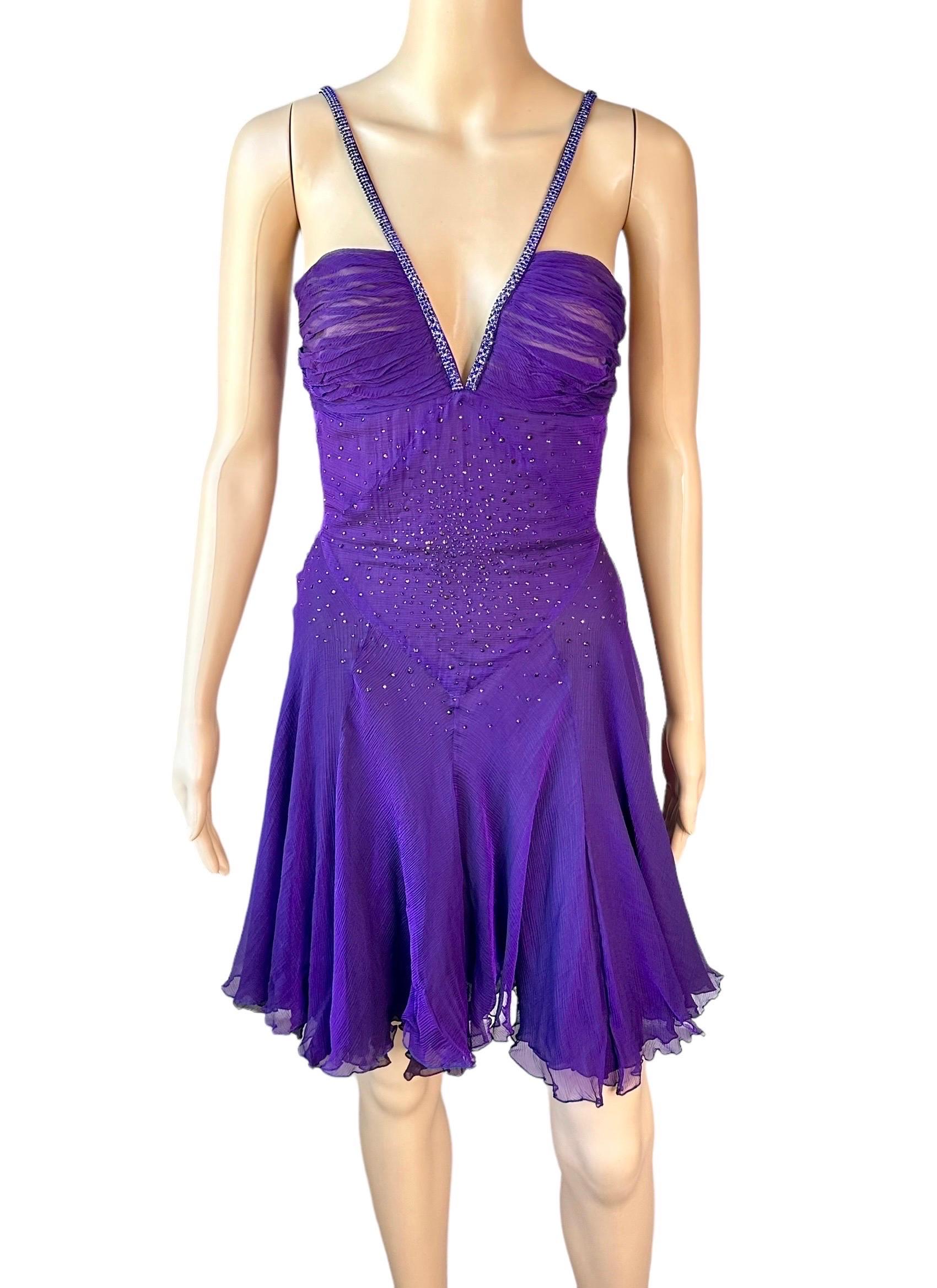 Versace c.2007 Crystal Embellished Plunging Neckline Semi-Sheer Purple Dress IT 42

Versace purple semi sheer dress featuring a plunging neckline, semi-exposed back, flared design, crystal embellished straps and rhinestones throughout the