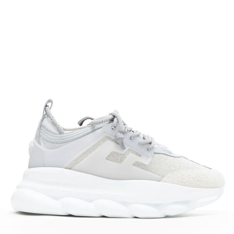VERSACE Chain Reaction Reflective Silver Crystal Rhinestone sneaker EU42 US9
Reference: TGAS/A06283
Brand: Versace
Designer: Salehe Bembury
Model: Versace Chain Reaction
Collection: Runway
Material: Fabric, Leather
Color: Silver
Pattern: