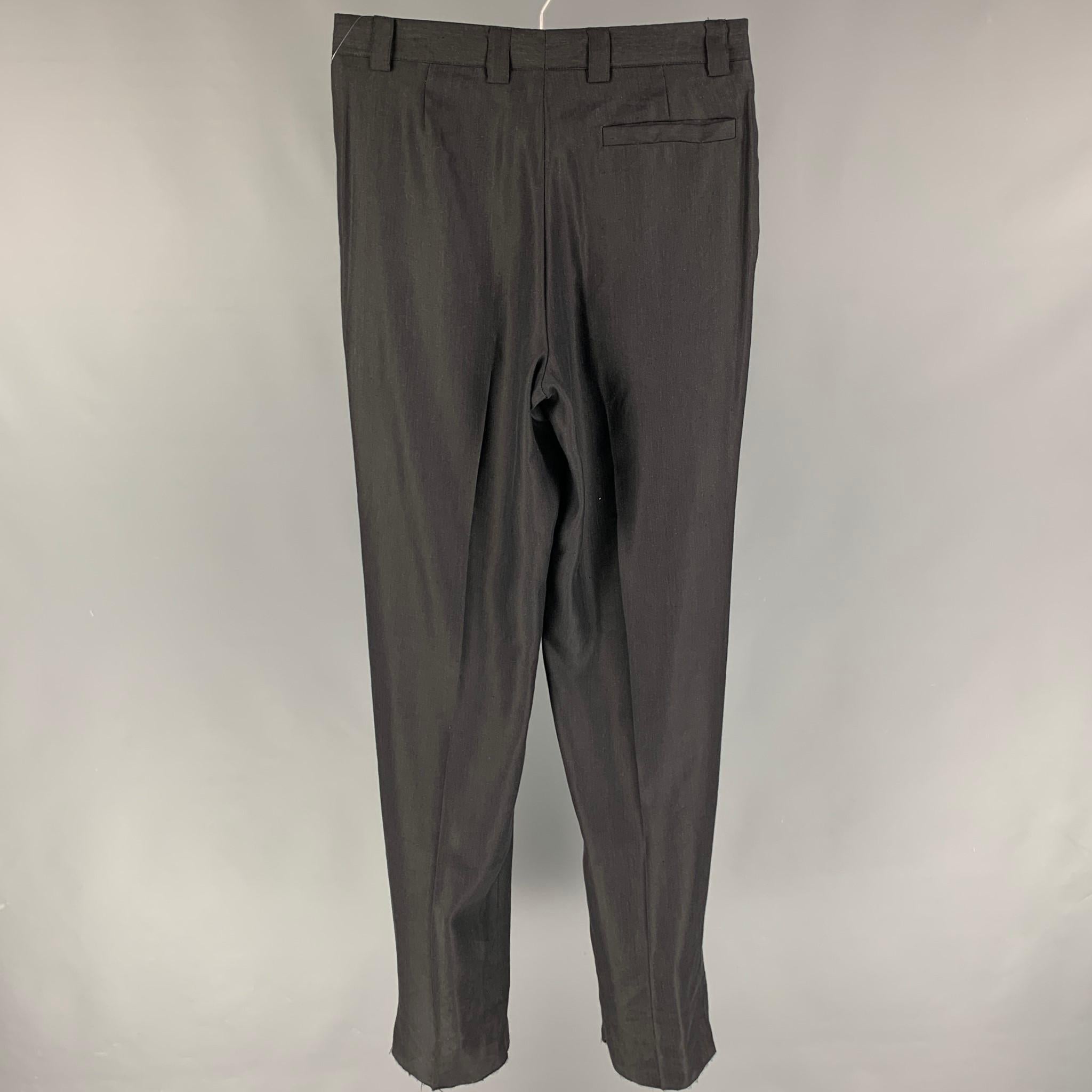 VERSACE CLASSIC dress pants comes in a black linen / nylon featuring a pleated style, high waisted, and a zip fly closure. Made in Italy. 

Very Good Pre-Owned Condition.
Marked: 48

Measurements:

Waist: 32 in.
Rise: 12 in.
Inseam: 38 in. 