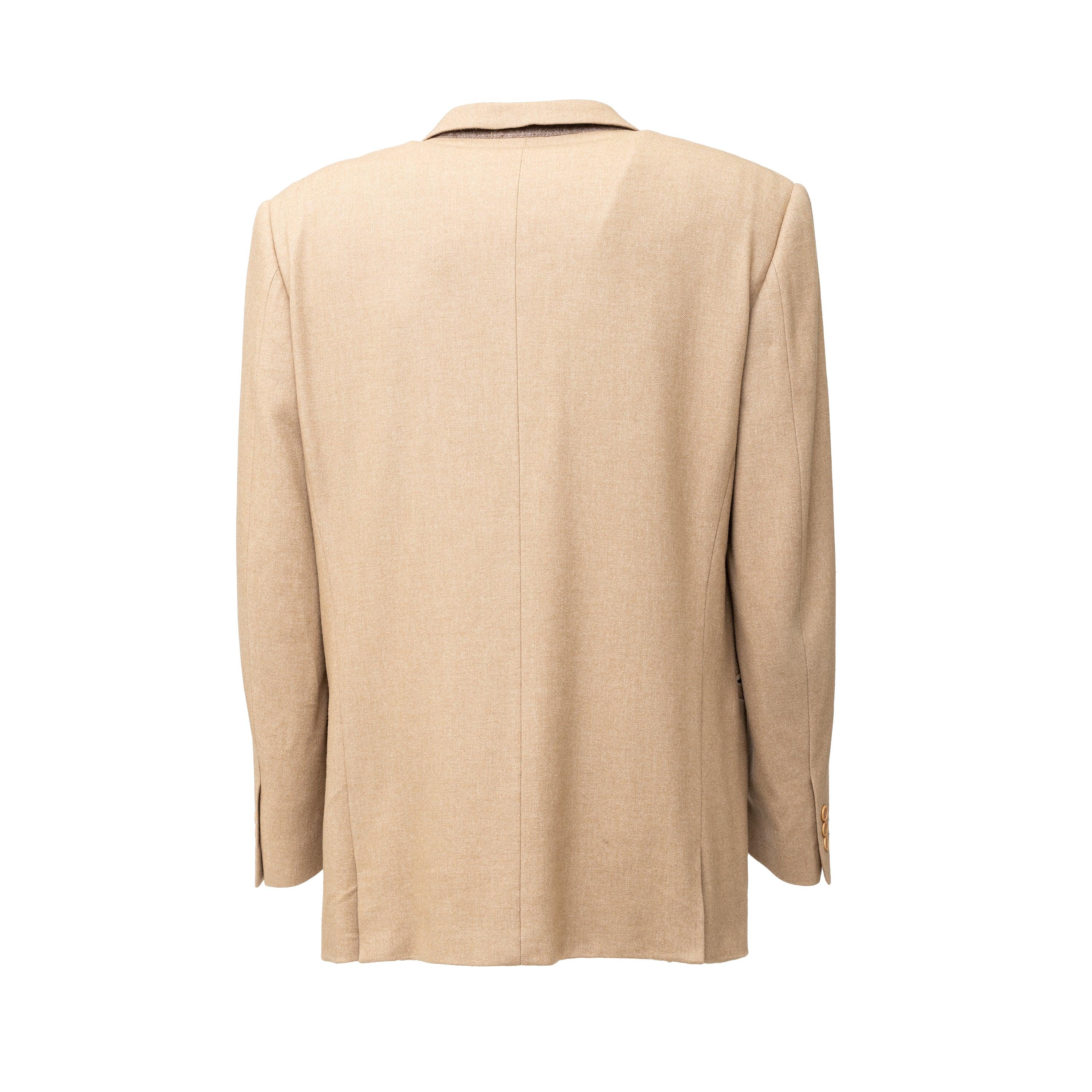This Versace Classic V2 Suit is made from a wool blend, providing a durable yet comfortable fit. The light beige color and notched lapel collar offer a chic look, enhanced by the brand emblem printed on the viscose lining and buttons. Four front