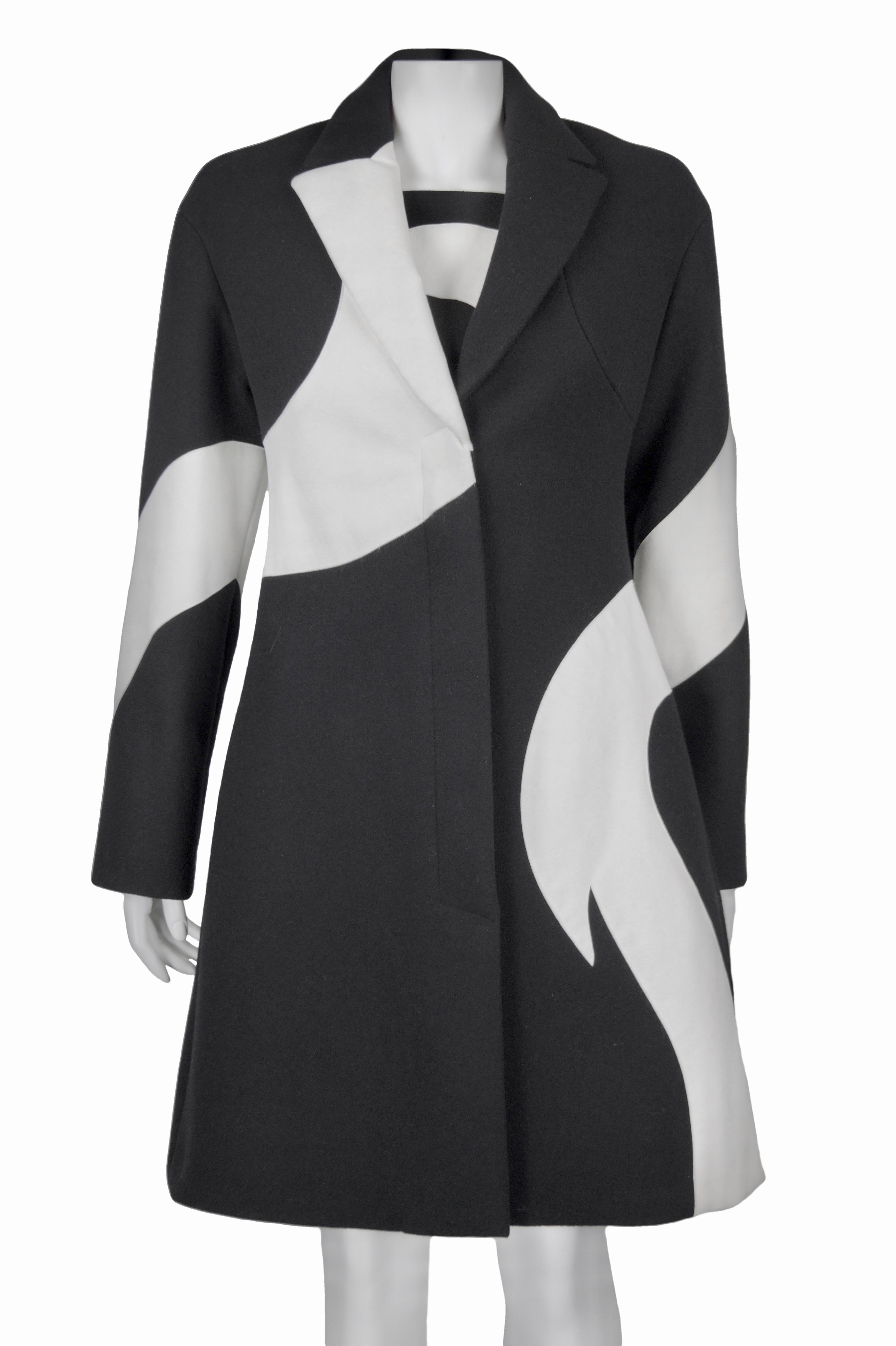 VERSACE FALL 2011 COLLECTION
Black and white coordinated coat and dress
Size  IT 40
Made in Italy
1st fabric (black): 100% wool
2nd fabric (white): 68% polyester 22% polyurethane and looks suede, but it is no t leather. It is alcantara fabric
100%