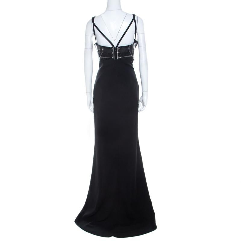 Feminine and beautiful, this Versace Collection ensemble is a true example of the brand's bold designs. This black gown has a comfortable fit and an elegant appeal to suit your evening look needs. Masterfully tailored with a plunging neckline and a
