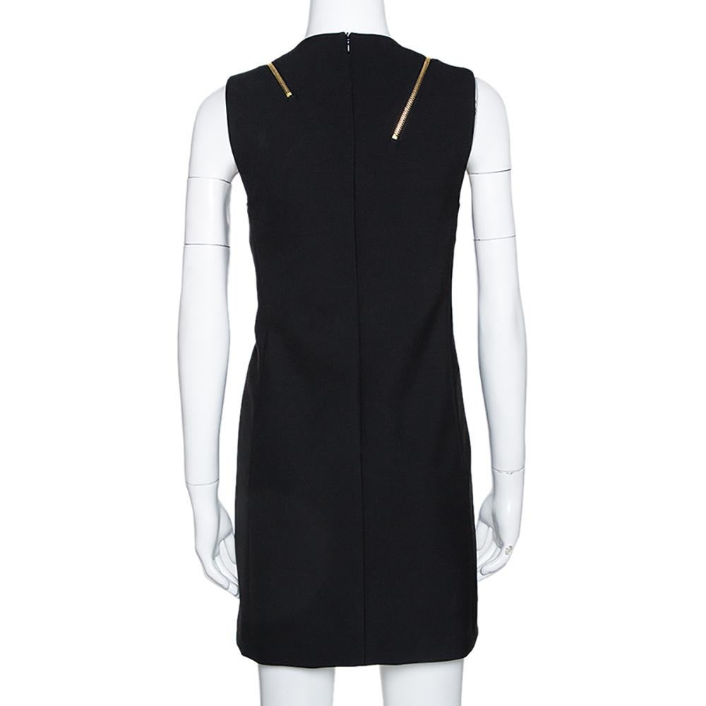 This stunning dress comes from the iconic house of Versace. Crafted from quality materials, this sleeveless dress comes in a classic shade of black. It is great for formal occasions and exudes sophistication. It is styled with a round neck, a good