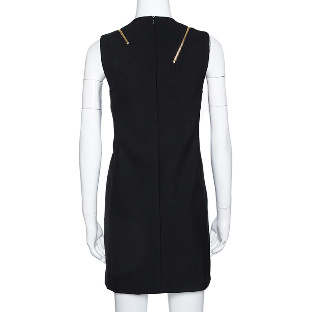 This stunning dress comes from the iconic house of Versace. Crafted from quality materials, this sleeveless dress comes in a classic shade of black. It is great for formal occasions and exudes sophistication. It is styled with a round neck, a good