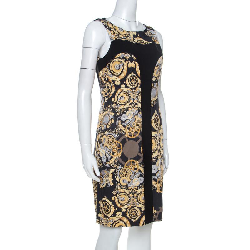 Stay in style with this trendy Versace dress that lends confidence and poise. It is crafted from a blend of quality fabrics and features a mechanic print that adds interest. It is tailored to offer a good fit and the silhouette makes it very