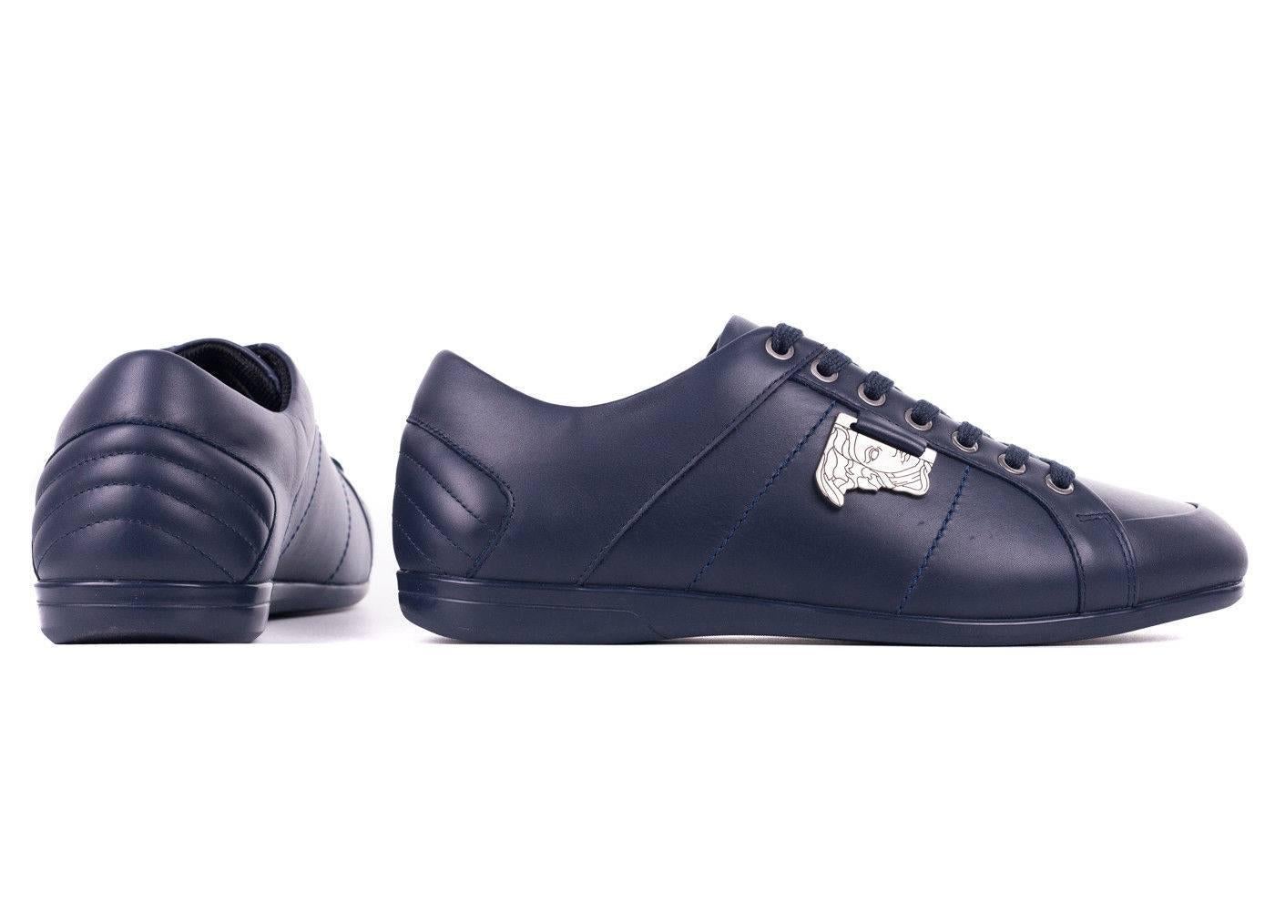Top off your outfit off with Versace's Navy Low Top Sneakers. This genuine leather masterpiece features Versace's signature Medusa Medallion on the side, tonal stitching, and a modern almond toe silhouette.

100% Leather
Navy Color
Half of Medusa