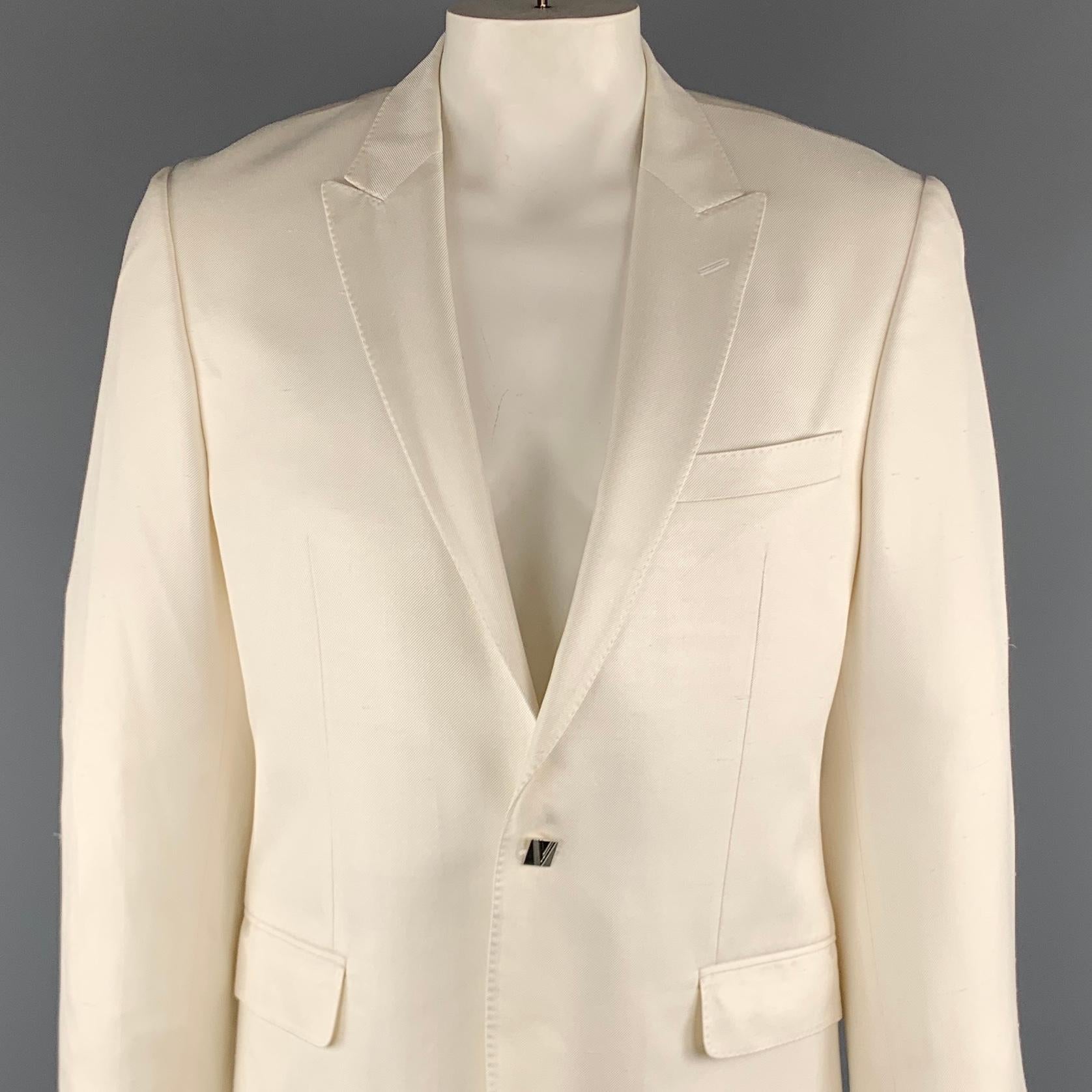 VERSACE COLLECTION Sport Coat comes in a off white textured silk featuring a peak lapel style, flap pockets, and a silver tone 