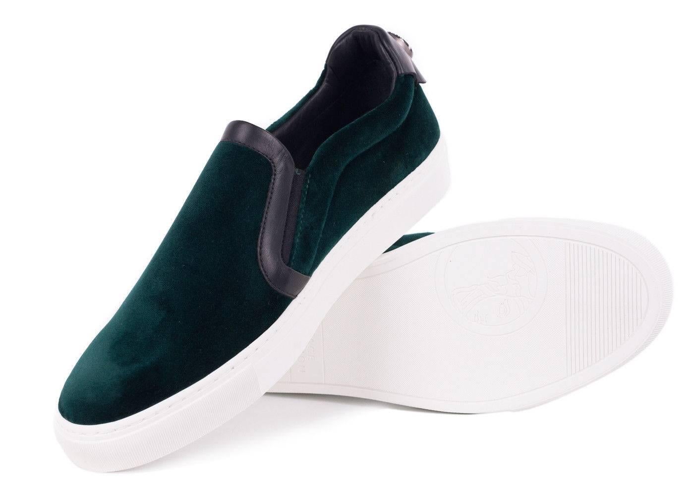 The man of the hour arrives in the Velvet Versace Slip On Sneakers. This work of art features rich emerald green velvet, black leather trimming, and a casually complimenting white rubber sole. Pair these shoes with the pants of the season in plaid