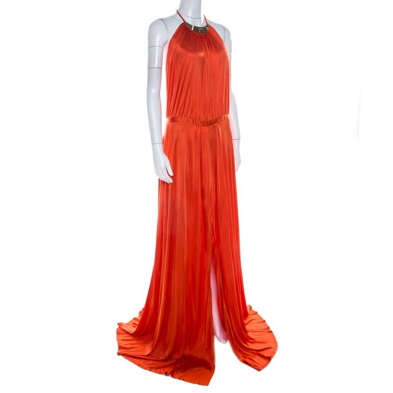 Incorporate this ethereal Versace evening gown to your wardrobe. Characterised by expert tailoring, this bright orange piece will look classic each time you wear it. Designed in fine fabric, the dress features a floor-grazing length with a halter