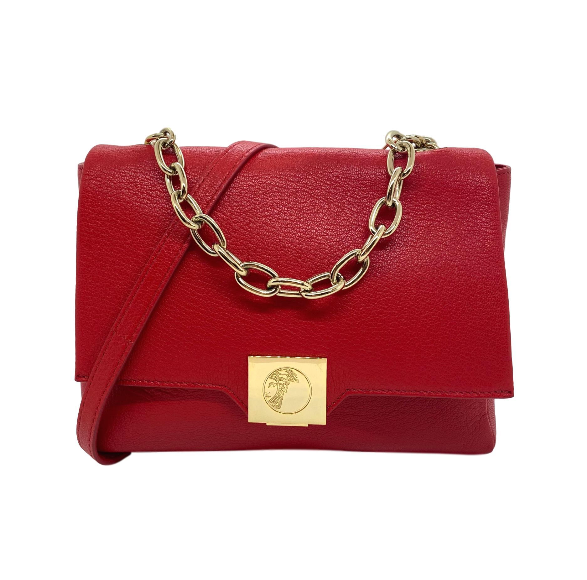 Versace Collection Red Fold-Over Leather Crossbody Bag, circa 2019. Established in 1978, Gianni Versace became well known world wide for his use of bold colors and bright prints inspired and designed around ancient Greek mythology. This Versace