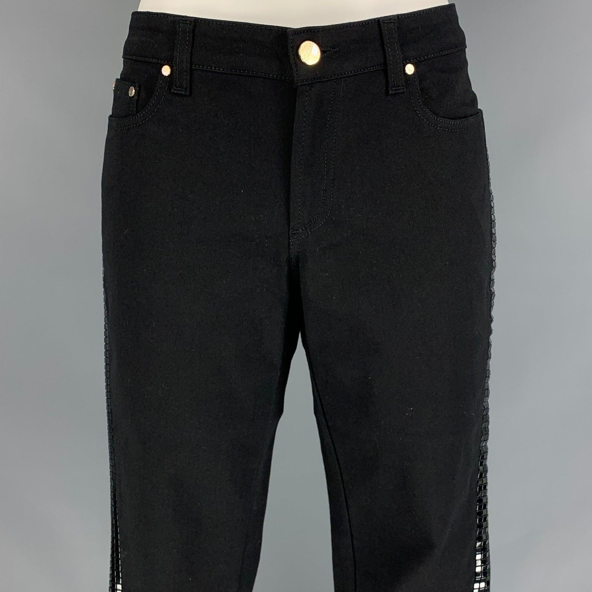 VERSACE COLLECTION casual pants comes in a black cotton blend featuring a skinny fit, side studded design, silver tone hardware, and a zip fly closure. Made in Romania.
New With Tags.
 

Marked:   24  

Measurements: 
  Waist: 26 inches  Rise: 7.5