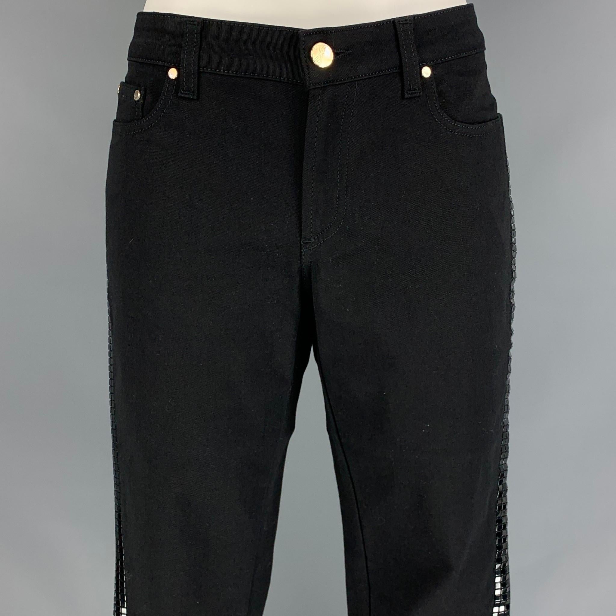 VERSACE COLLECTION casual pants comes in a black cotton blend featuring a skinny fit, side studded design, silver tone hardware, and a zip fly closure. Made in Romania. 

New With Tags. 
Marked: 24

Measurements:

Waist: 26 in.
Rise: 7.5 in.
Inseam: