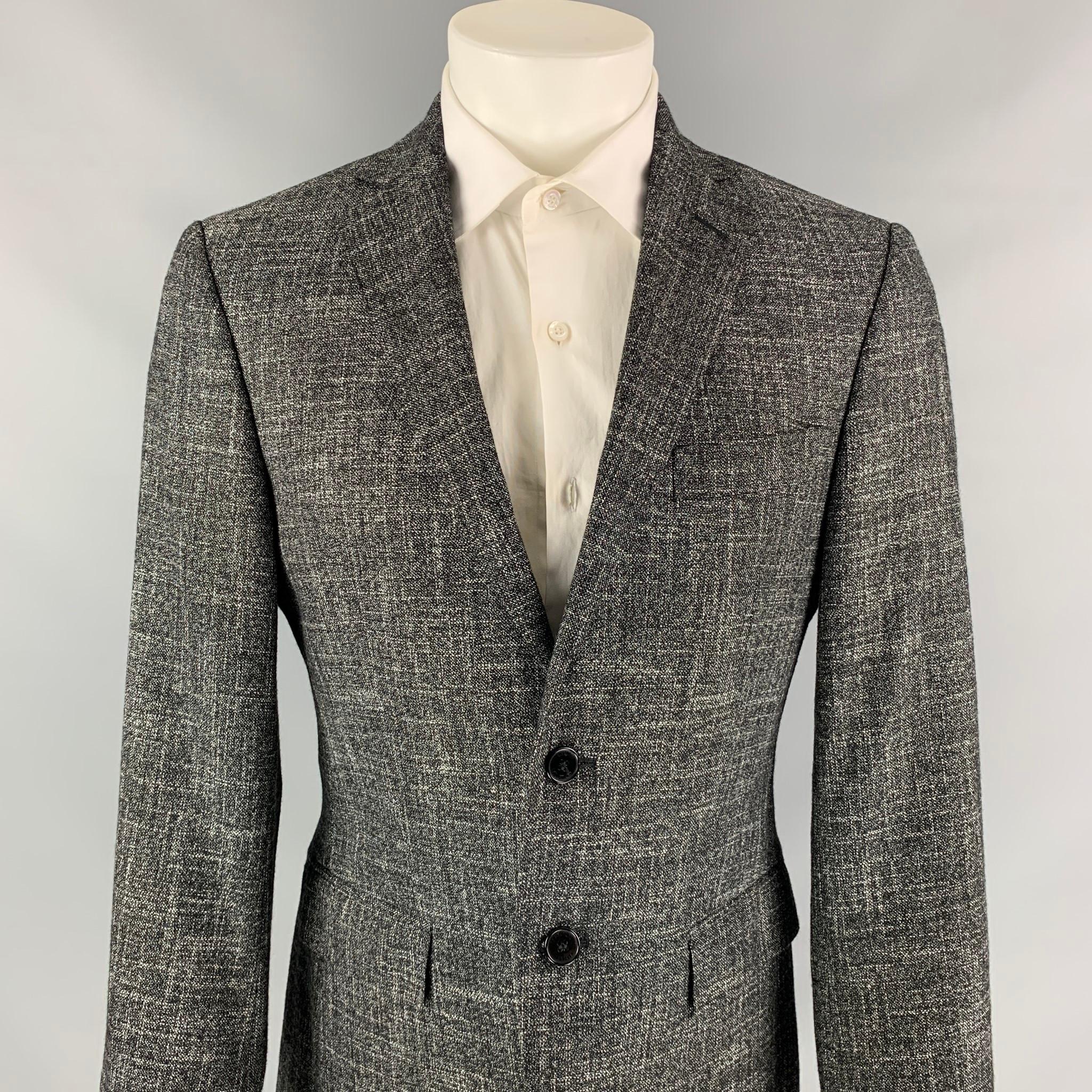 VERSACE COLLECTION sport coat comes in a dark gray & white heather wool blend with a full liner featuring a notch lapel, flap pockets, and a two button closure. 

Very Good Pre-Owned Condition.
Marked: 46

Measurements:

Shoulder: 17.5 in.
Chest: 40