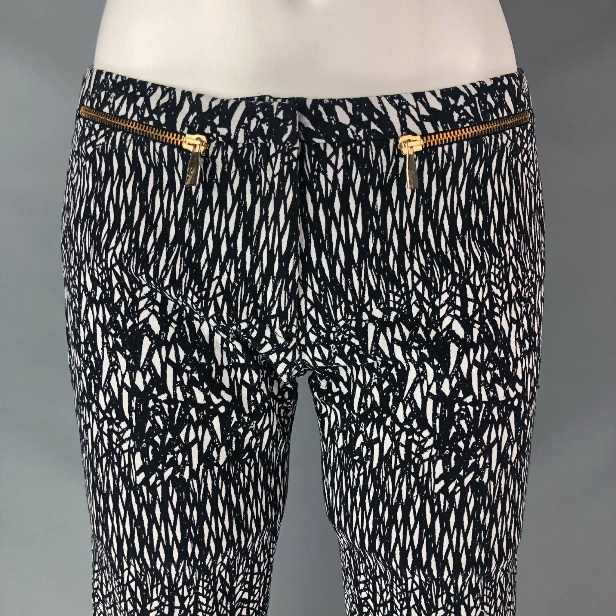 VERSACE COLLECTION Slim casual pants comes in a black and white abstract cotton blend fabric featuring gold hardware Flat Front, zipper hook and bar closure. Excellent Pre-Owned Condition.  

Marked:   40 IT 

Measurements: 
  Waist: 31 inRise: 7.5