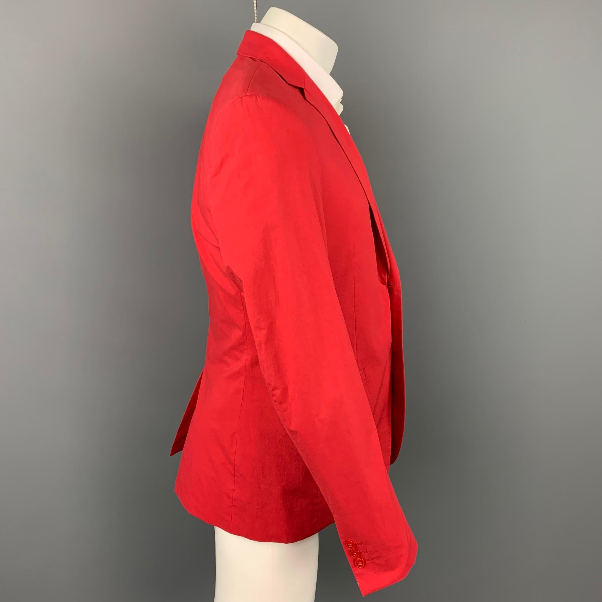 VERSACE COLLECTION sport coat comes in a red cotton with a full print liner featuring a notch lapel, flap pockets, and a two button closure. Made in Romania.

Very Good Pre-Owned Condition.
Marked: 50

Measurements:

Shoulder: 18 in.
Chest: 40