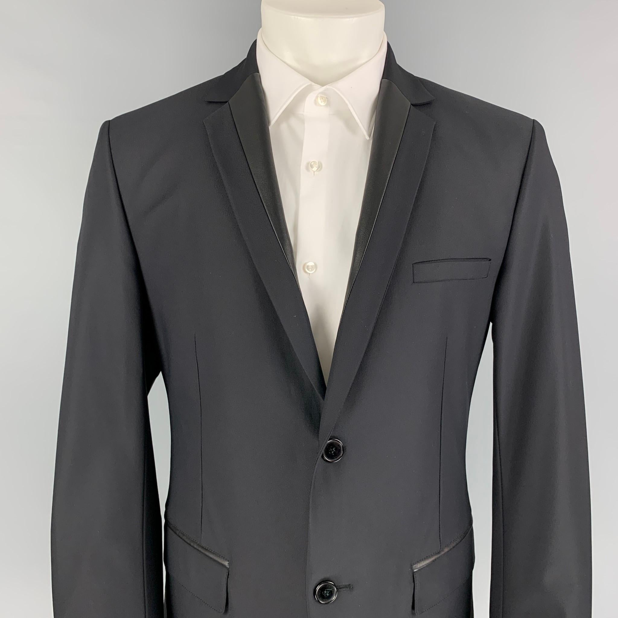 VERSACE COLLECTION sport coat comes in a black polyamide with a full liner featuring a notch lapel, leather trim, flap pockets, single back vent, and a double button closure. Made in Romani. 

Excellent Pre-Owned Condition.
Marked: