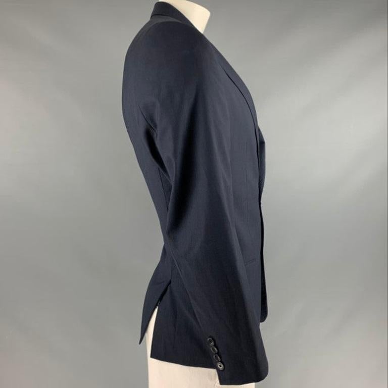 VERSACE COLLECTION sport coat
in a navy wool fabric featuring single breasted style, notch lapel, and double button closure.Very Good Pre-Owned Condition.
Moderate signs of wear. 

Marked:   54  

Measurements: 
 
Shoulder: 17.5 inches Chest: 44