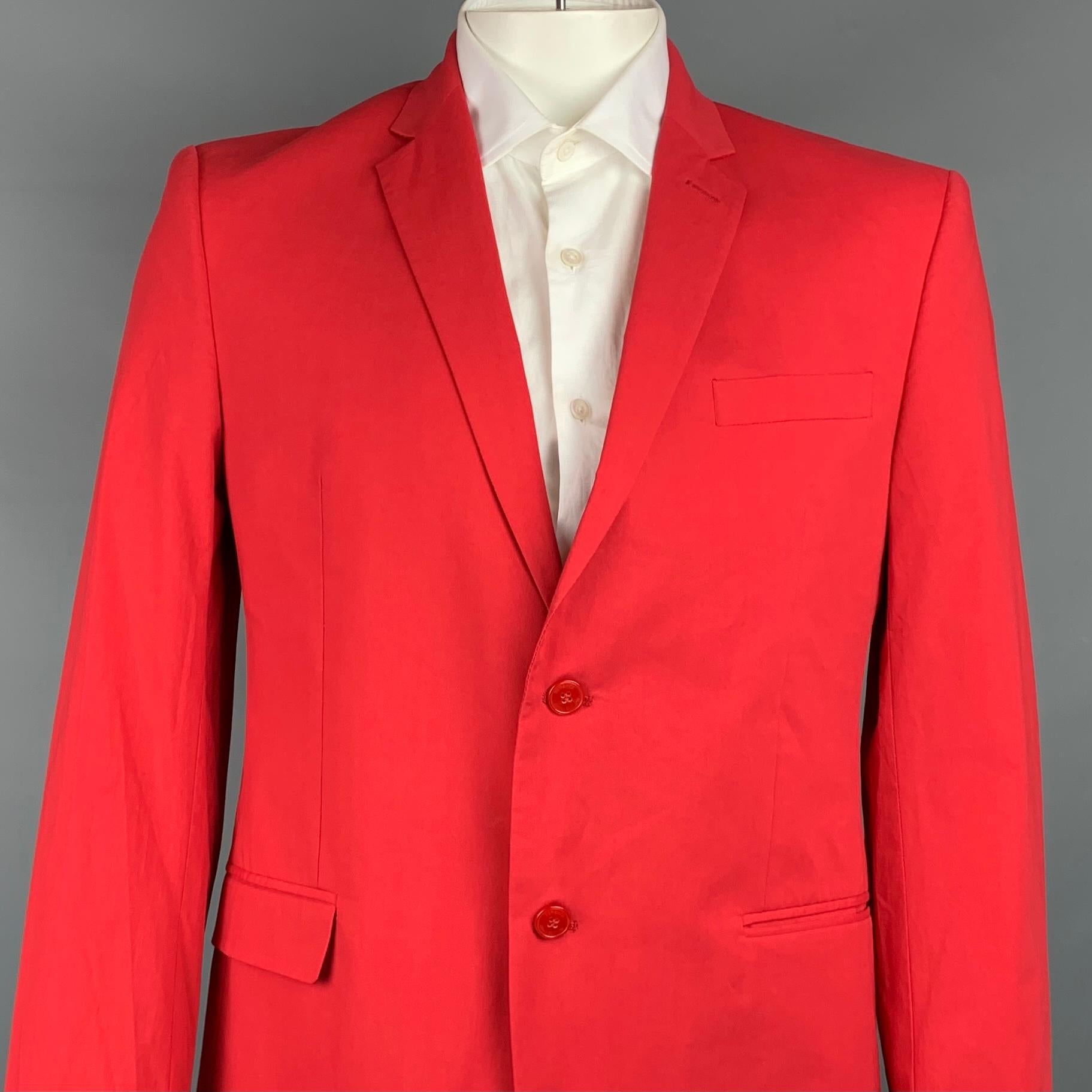 VERSACE COLLECTION sport coat comes in a red cotton with a full monogram print liner featuring a notch lapel, slit pockets, and a double button closure. Made in Romania.

Very Good Pre-Owned Condition.
Marked: 54

Measurements:

Shoulder: 18.5