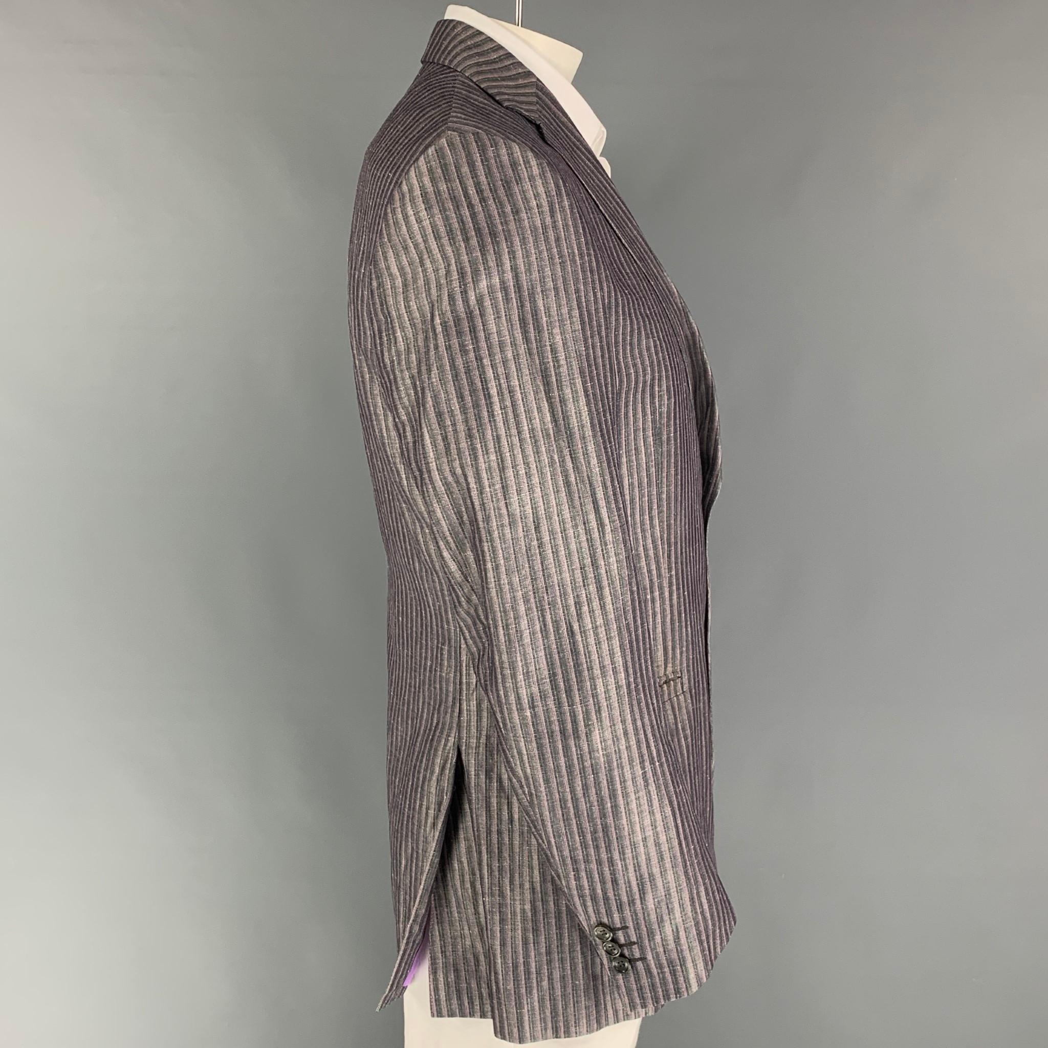 VERSACE COLLECTION sport coat comes in a lavender & pink stripe wool / line featuring a notch lapel, slit pockets, double back vent, and a double button closure. 

Very Good Pre-Owned Condition.
Marked: 54

Measurements:

Shoulder: 19 in.
Chest: 54