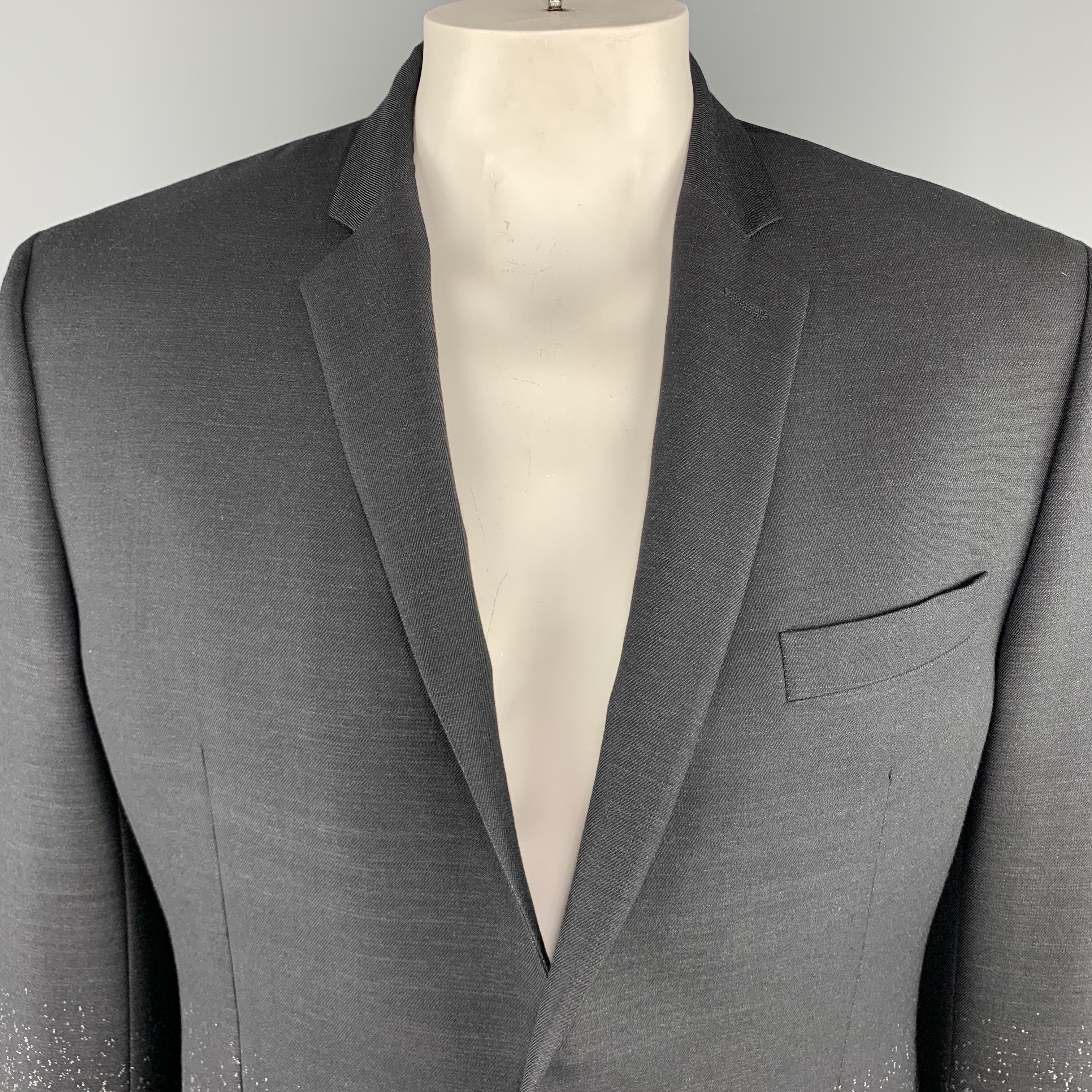 VERSACE - COLLECTION Sport Coat comes in black and grey tones in an ombre wool material, with a notch lapel, slit and flap pockets, two buttons at closure, single breasted, and buttoned cuffs.

Excellent Pre-Owned Condition.
Marked: