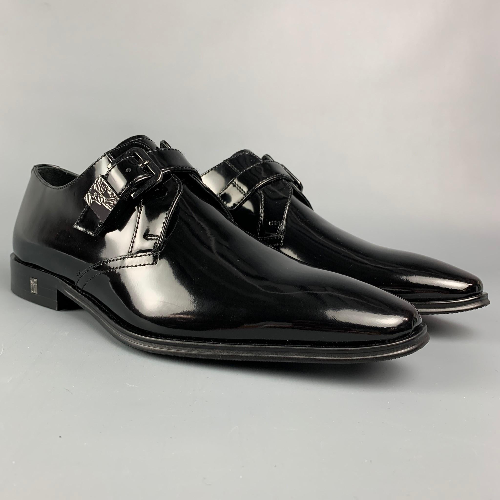 VERSACE COLLECTION loafers comes in a black patent leather featuring a gunmetal strap and a square toe. Comes with box. 

Excellent Pre-Owned Condition.
Marked: 40
Original Retail Price: $395.00

Outsole: 11.5 in. x 3.5 in.
