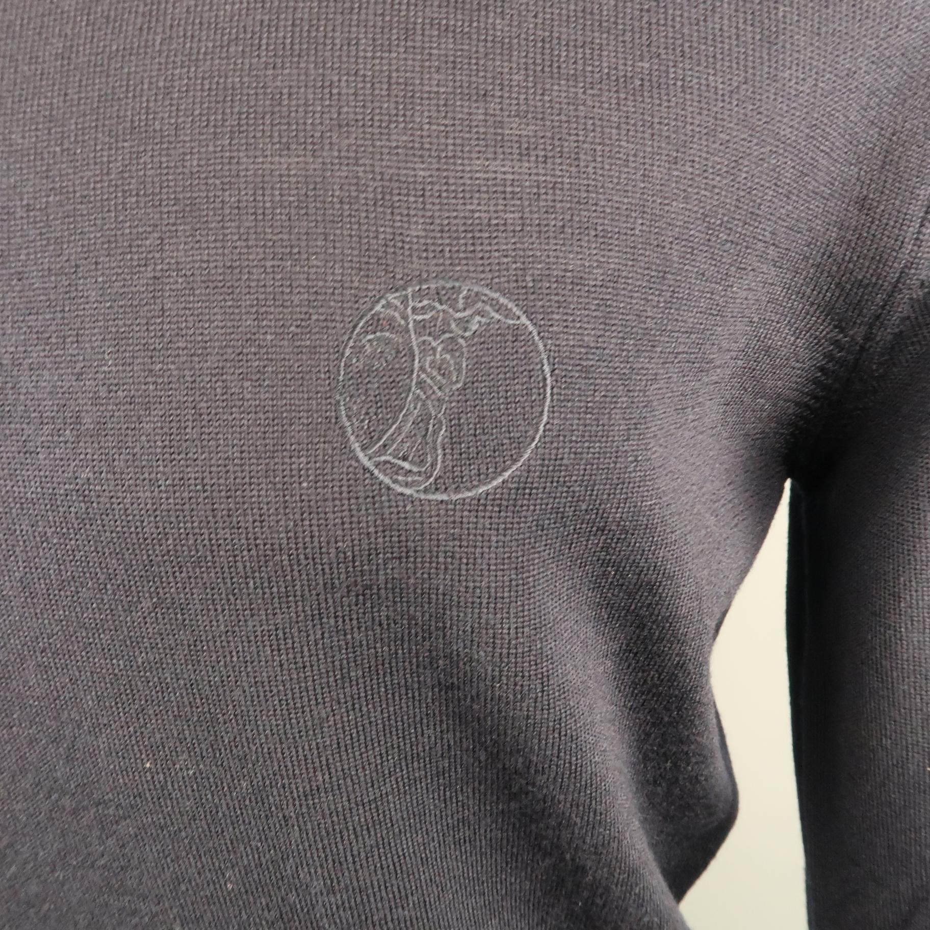 VERSACE COLLECTION pullover comes in a navy merino wool featuring a front half 