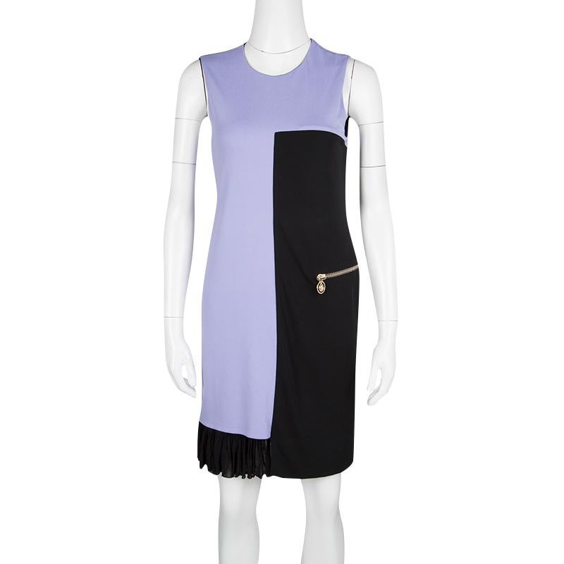 This beautiful Versace dress can look smart for formal and professional wear or to look stylish enough for those chic parties and events. Designed in a very geometric lilac and black colourblock pattern, this dress is further softened with the use