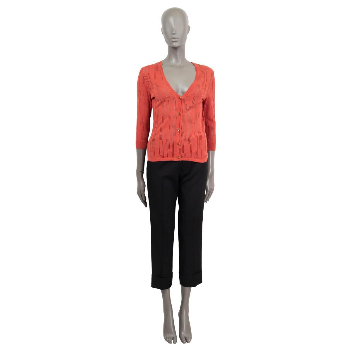 100% authentic Versace pointelle fine-knit cardigan in coral viscose (63%) and cotton (37%). Features a gold-ton medusa buttons and a v-neck. Has been worn and is in excellent condition.

Measurements
Tag Size	40
Size	S
Shoulder Width	40cm