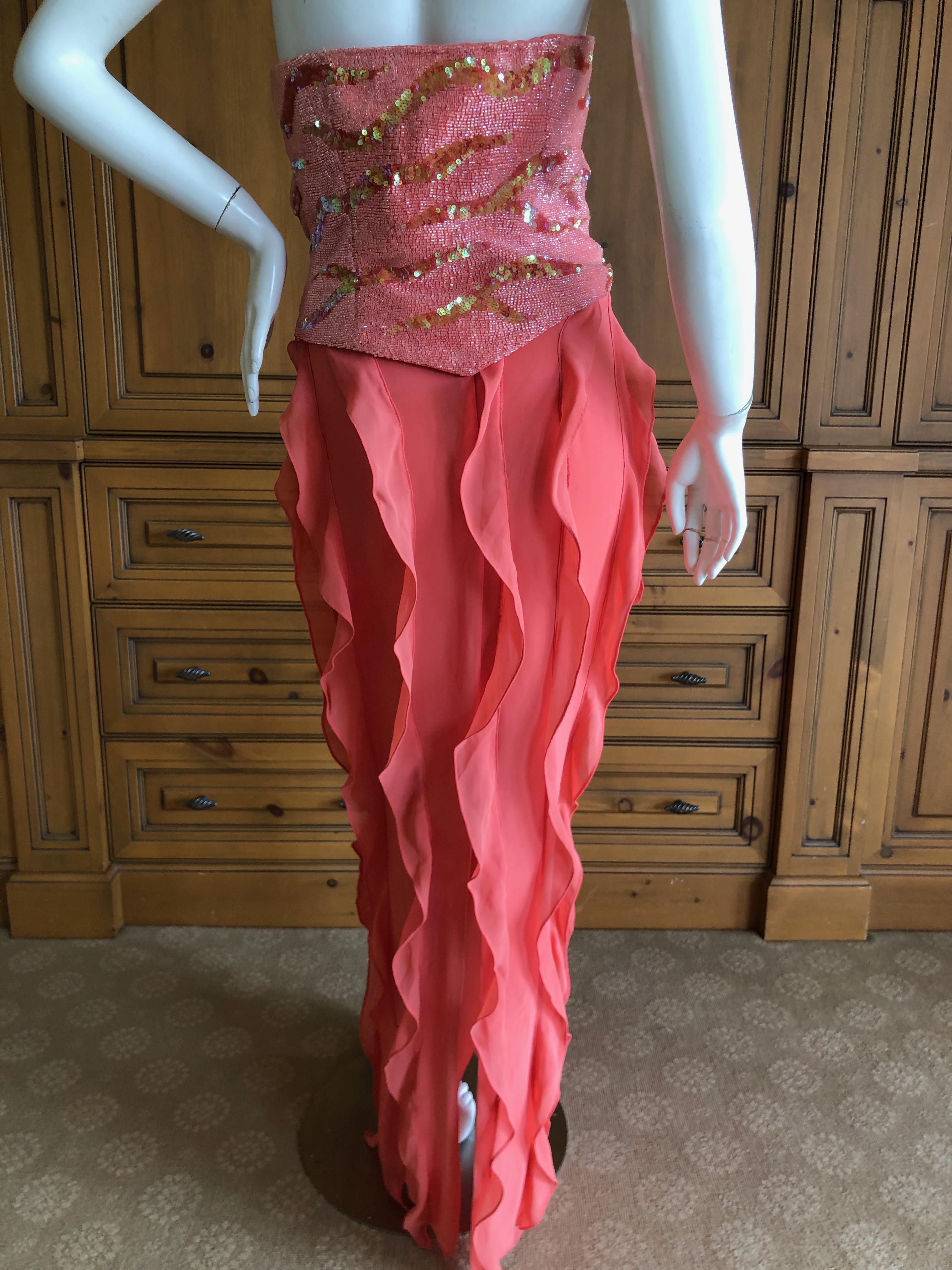 Versace Coral Vintage SIlk Bustier Dress with Glass Bugle Beading and Sequins
This is such a pretty piece,  the top and bottom are separate , a bustier and matching silk skirt.
Marked size 42 but runs small
 Bust 34