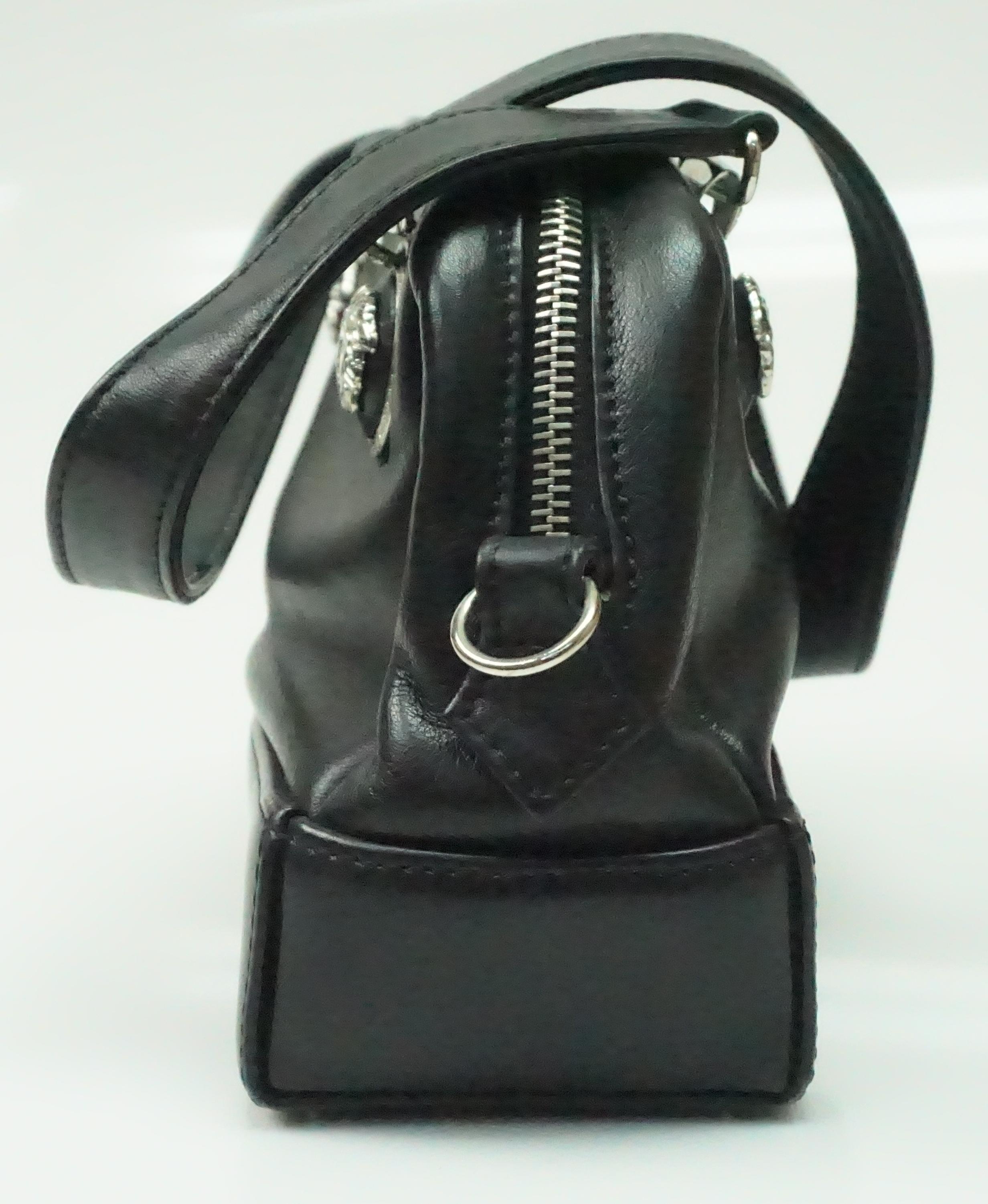 Versace Couture BLACK leather cross body Purse. This fabulous Versace cross body is in great condition. It shows barely any sign of use, it has one small white scuff/mark on the front left corner and slight aging on one of the cross body leather