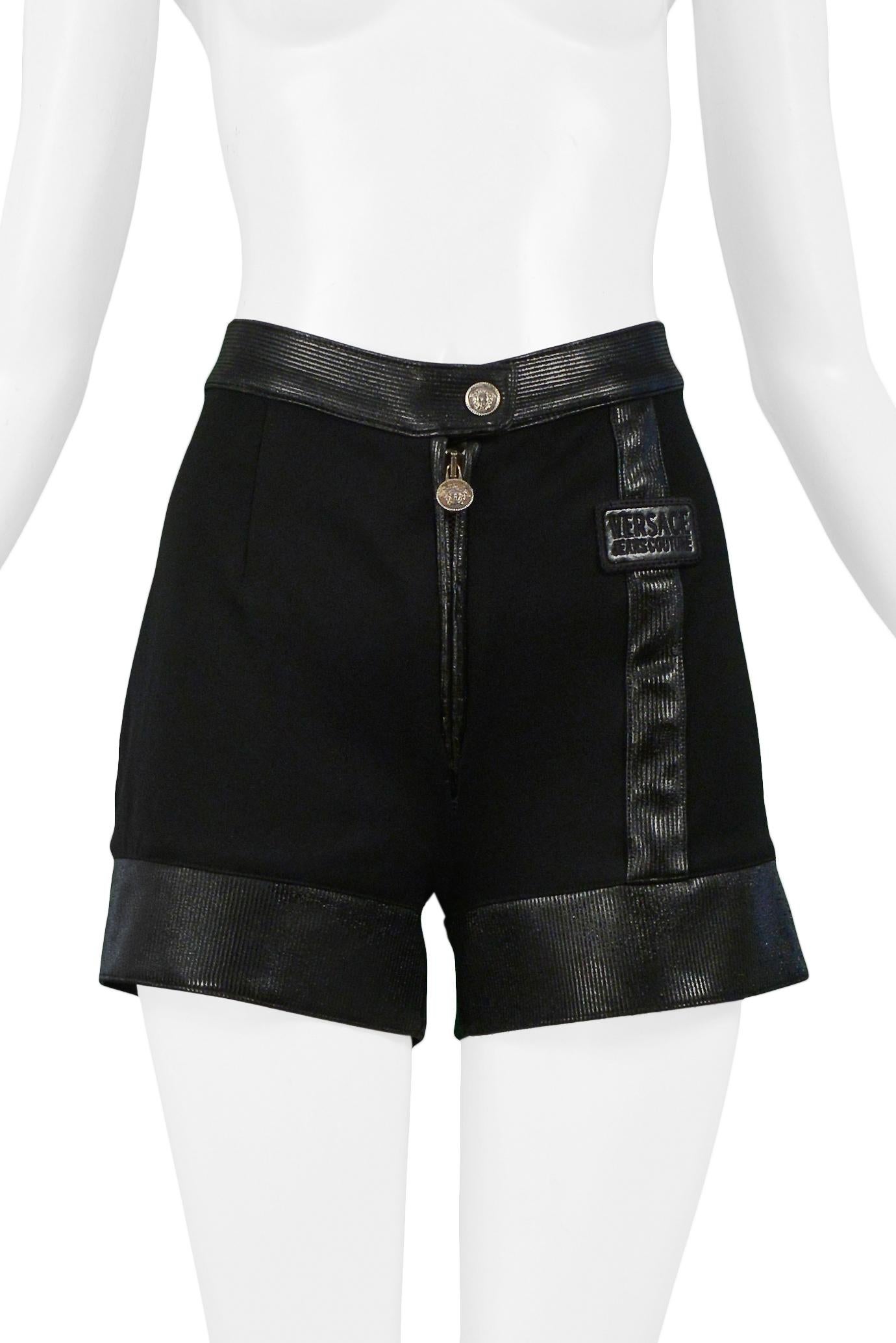 Resurrection Vintage is excited to offer rare and unusual vintage Versace Couture black shorts with gold Medusa button, zipper pull, and faux leather trim at the hem and waistband.

Versace Couture
Size 38
Woven & Faux Leather 
Excellent Vintage