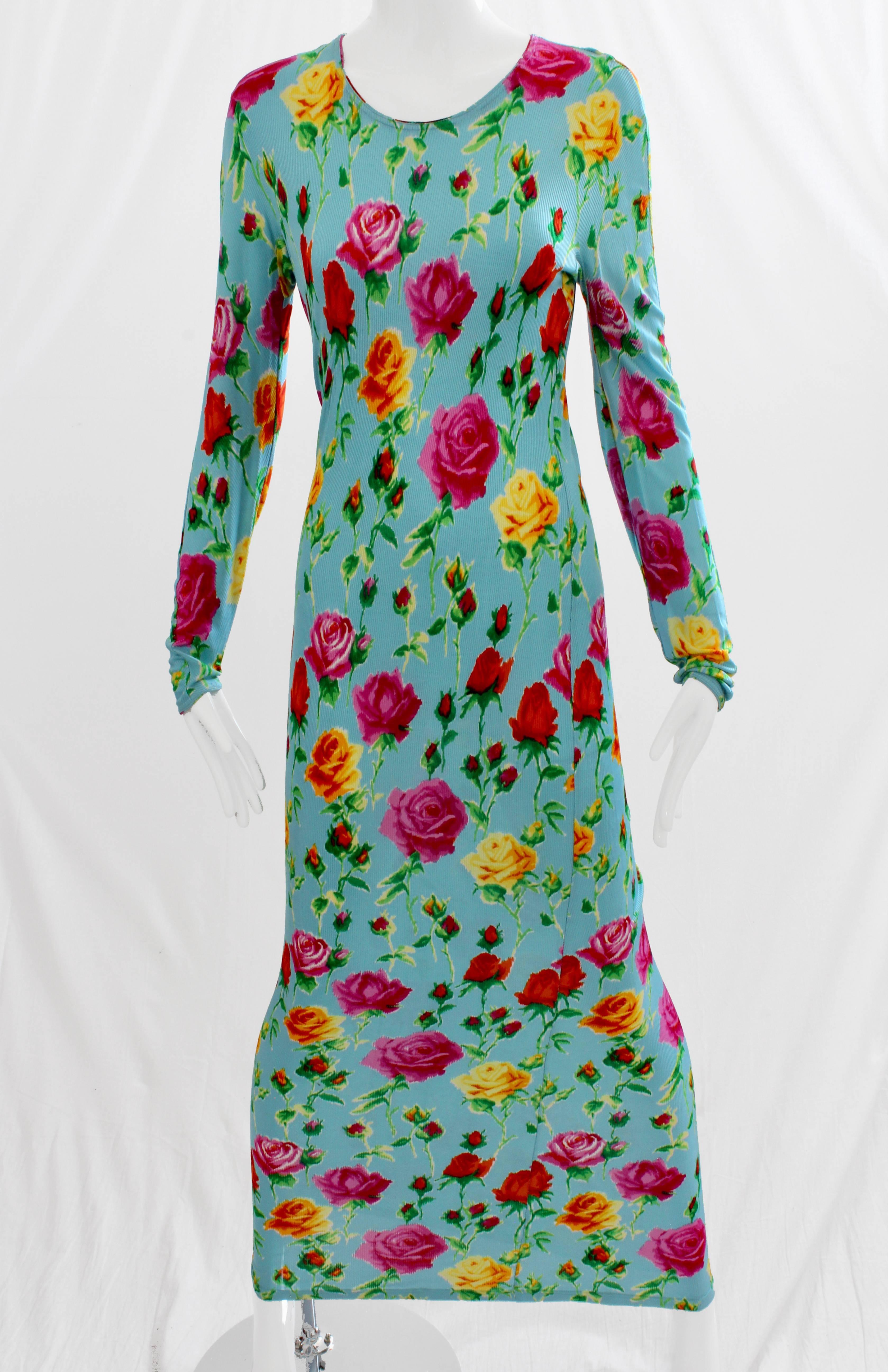 This floral print dress appears in catalog 28 GIANNI VERSACE Collezione Donna Primavera Estate 1995. In excellent condition for its age, with no issues to report. Fastens with rear zip and hook/eye closure and is unlined. No size tag but we're