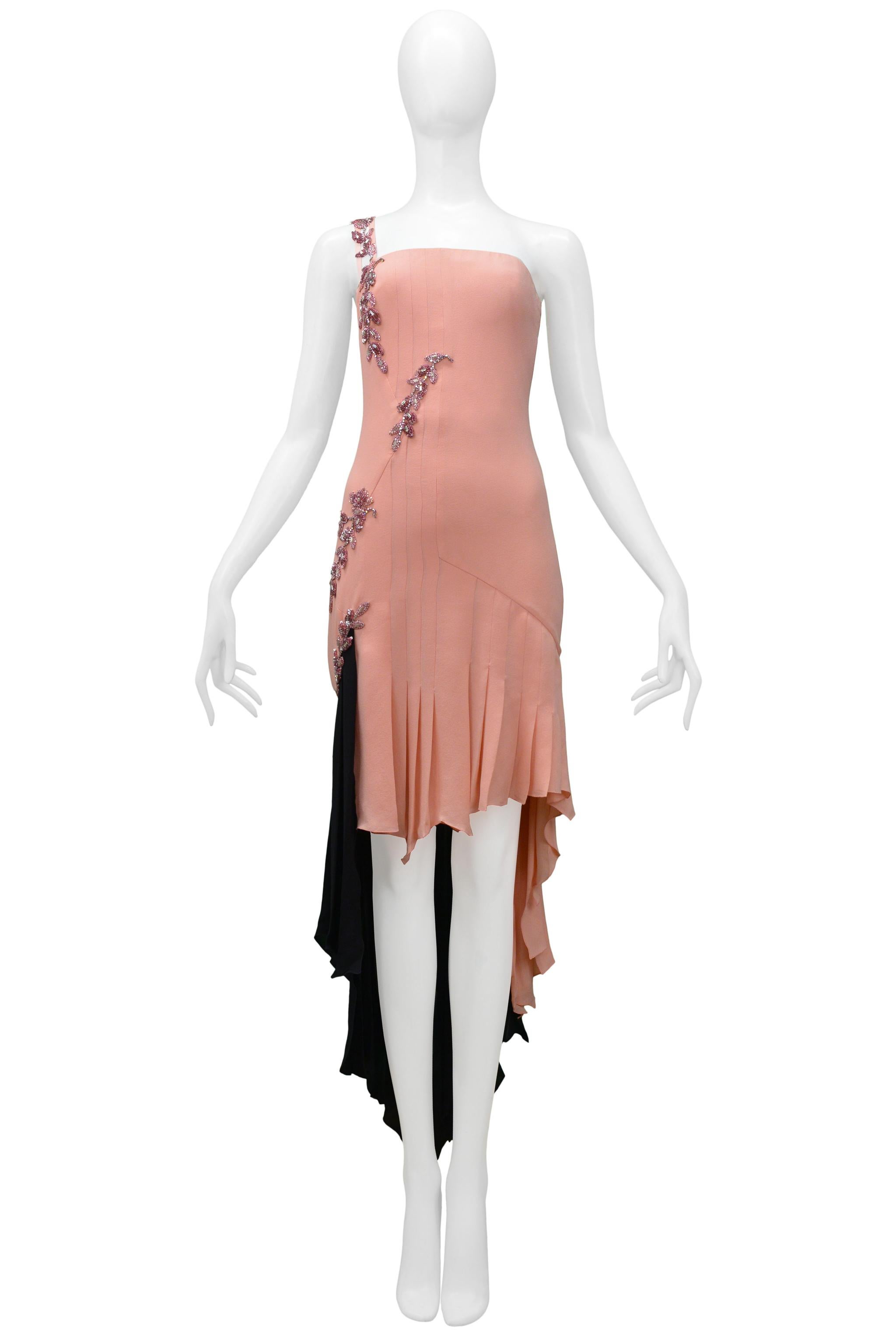Resurrection Vintage is excited to offer a Versace Couture black and pink deconstructed cocktail dress featuring rhinestones and beading, a pleated skirt, an asymmetrical strap, and a high-low hemline. This dress has never been worn and comes with