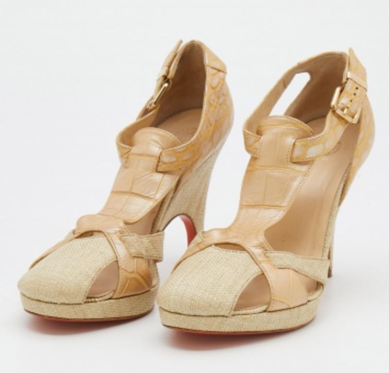 Flaunt your exquisite taste in fashion by wearing these attractive sandals from Versace. Designed using croc-embossed leather and raffia, these stunners provide nothing but glam to your feet. They are completed with rounded toes, platforms, buckled