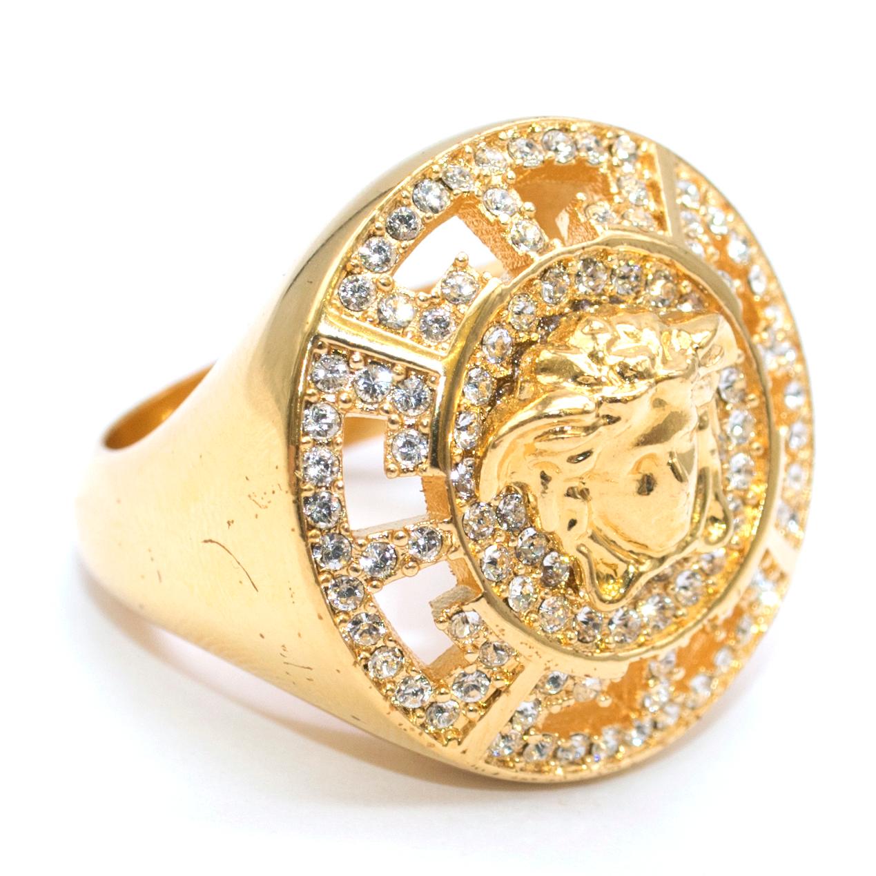 Versace Crystal Embellished Medusa Head Ring 

- Gold tone Greek & Medusa ring 
- Greek detail embellished with white crystals

Matching pairing is available

Please note, these items are pre-owned and may show some signs of storage, even when