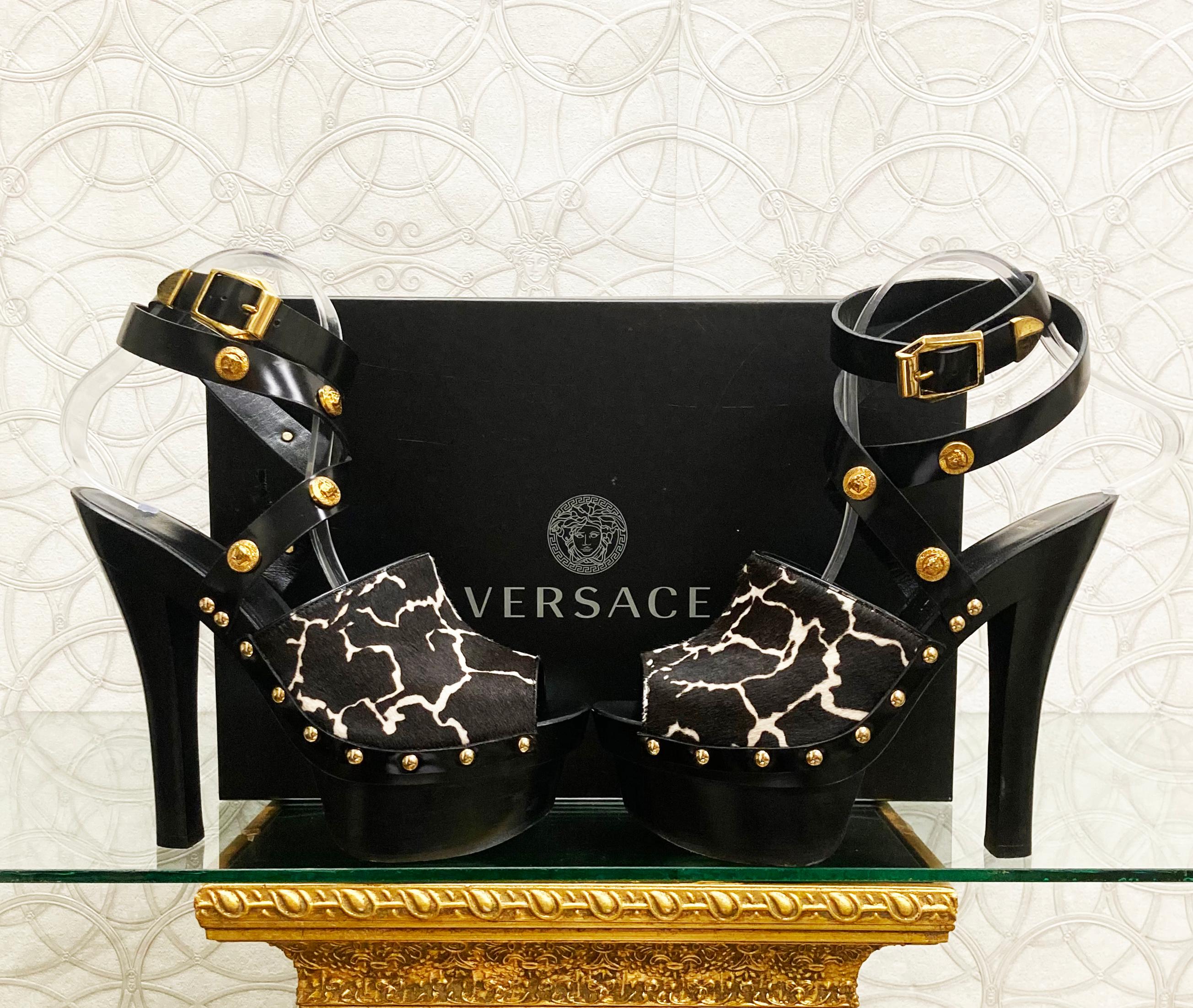 VERSACE

Dark Brown Fur Leather sandals shoes with gold Famous Medusa studs 

DETAILS:

Open toe and open heel

Buckling ankle strap closure

Content: 100% calfskin (Lining and Sole) 


   Color: Dark Brown/Black

Platform: 1 1/4