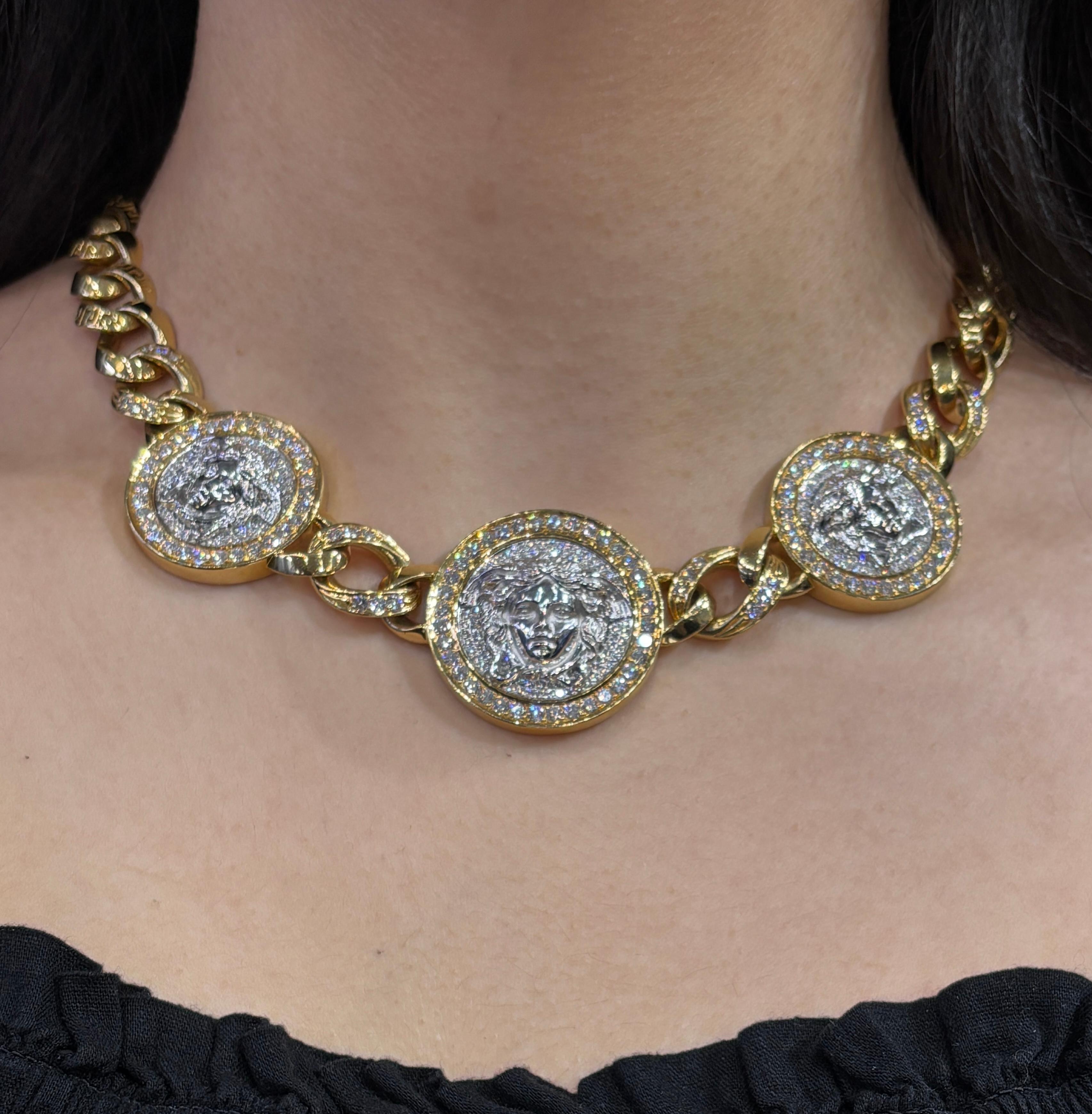 Versace Diamond Link Bracelet and Necklace Set

A yellow and white gold link bracelet and necklace set by Versace featuring Iconic Medusa motifs, each accented with a round-cut diamonds

Necklace and bracelet and can be worn together as a longer