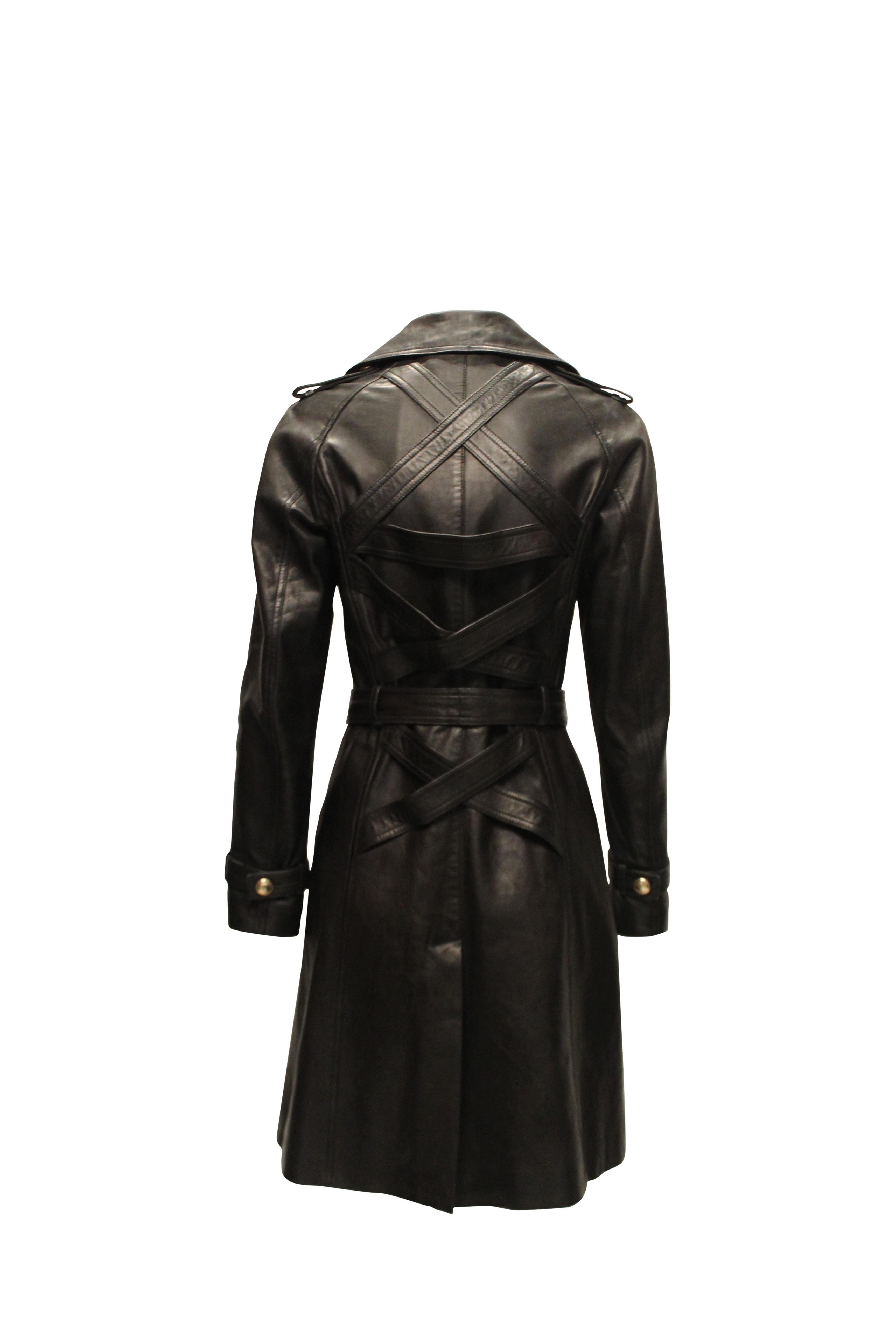Versace double breasted leather coat. Featuring gold toned medusa head buttons and belt clasp.