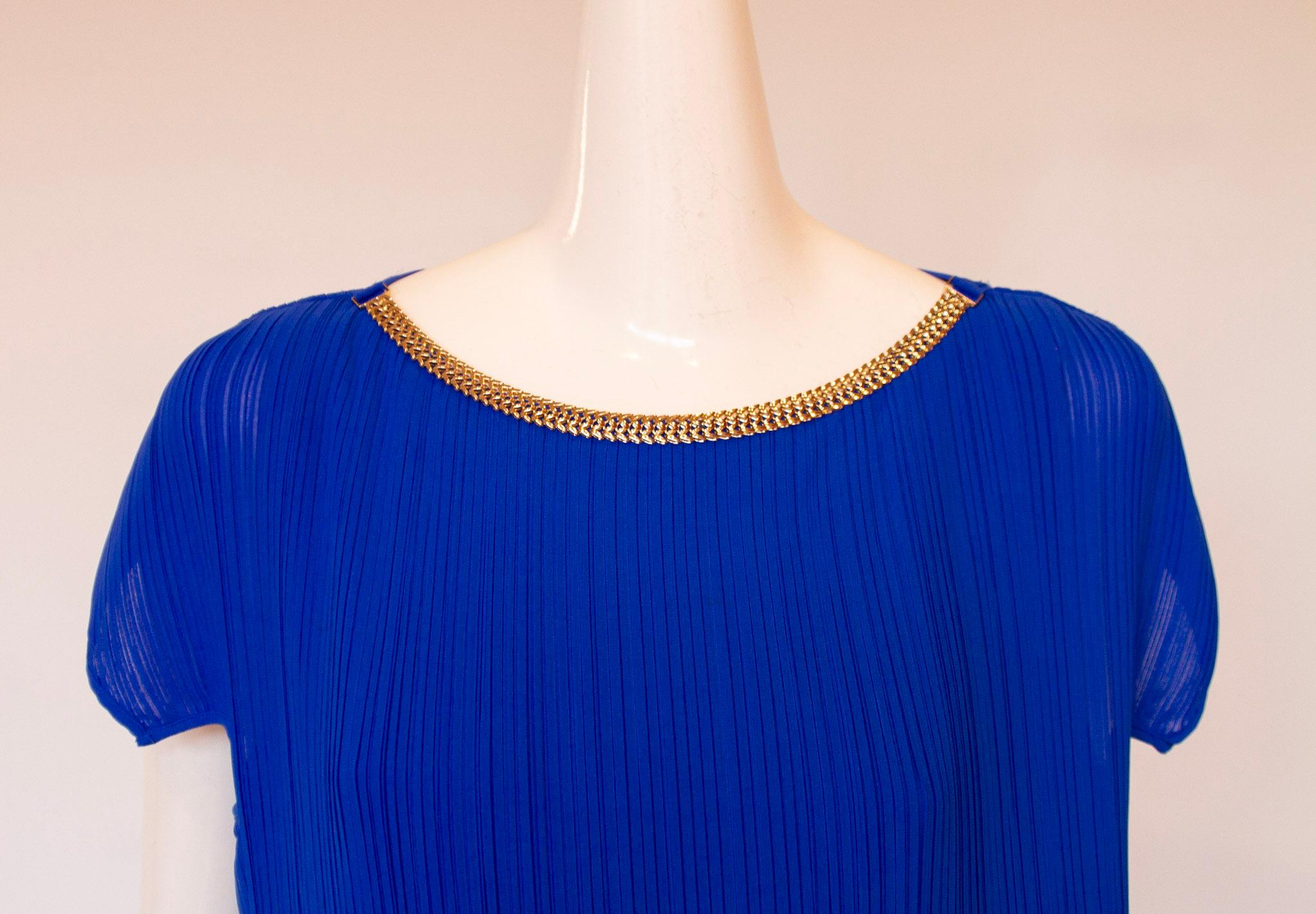 Gianni Versace electric blue pleated cap sleeve below the knee dress with metal logo on neckline 