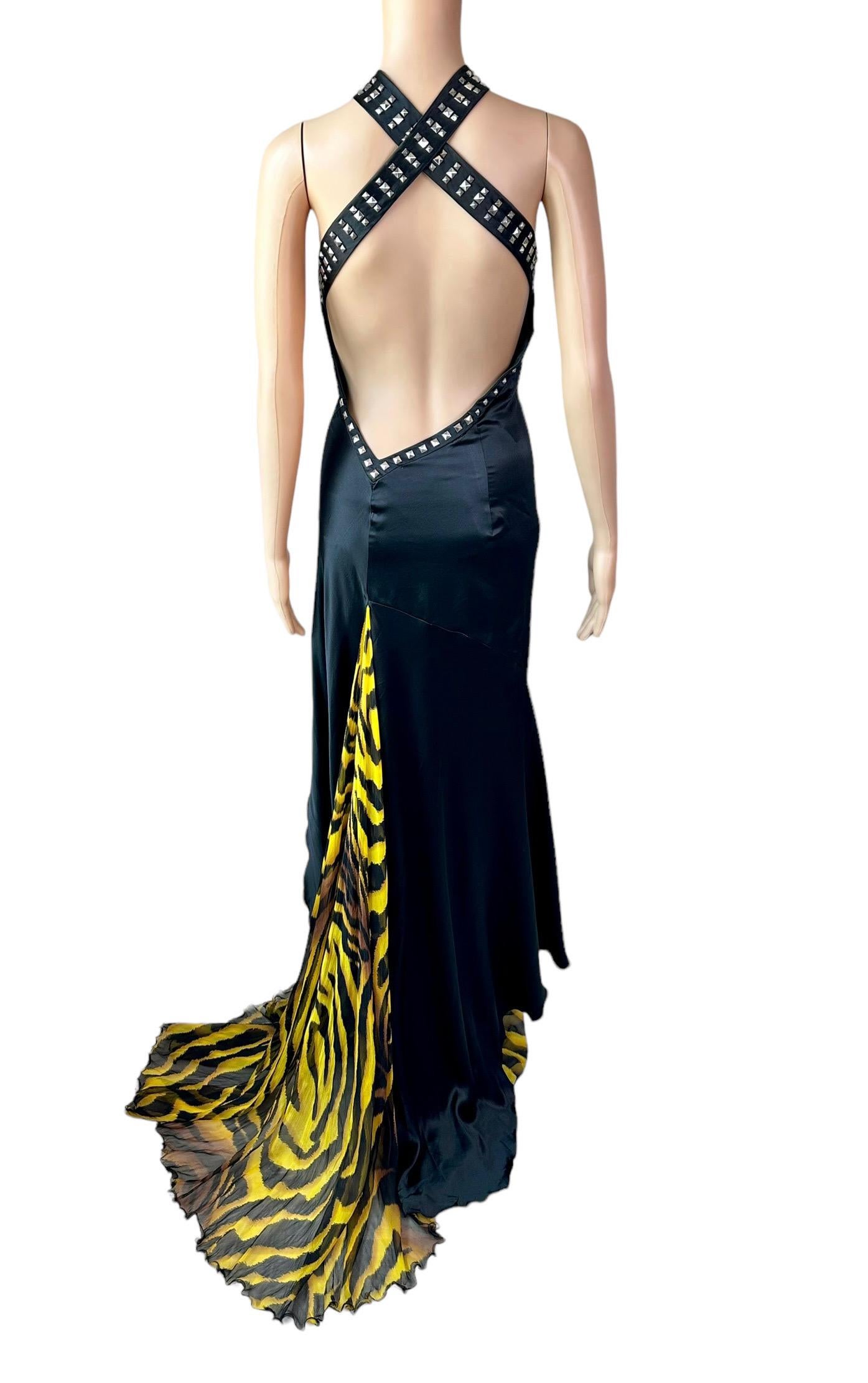 Versace F/W 2004 Runway Embellished Studded Bondage Halter Plunging Keyhole Neckline Open Back Evening Dress Gown IT 42

Look 51 from the Versace Fall Collection.

Versace silk black evening dress featuring silver square studs embellishments, halter
